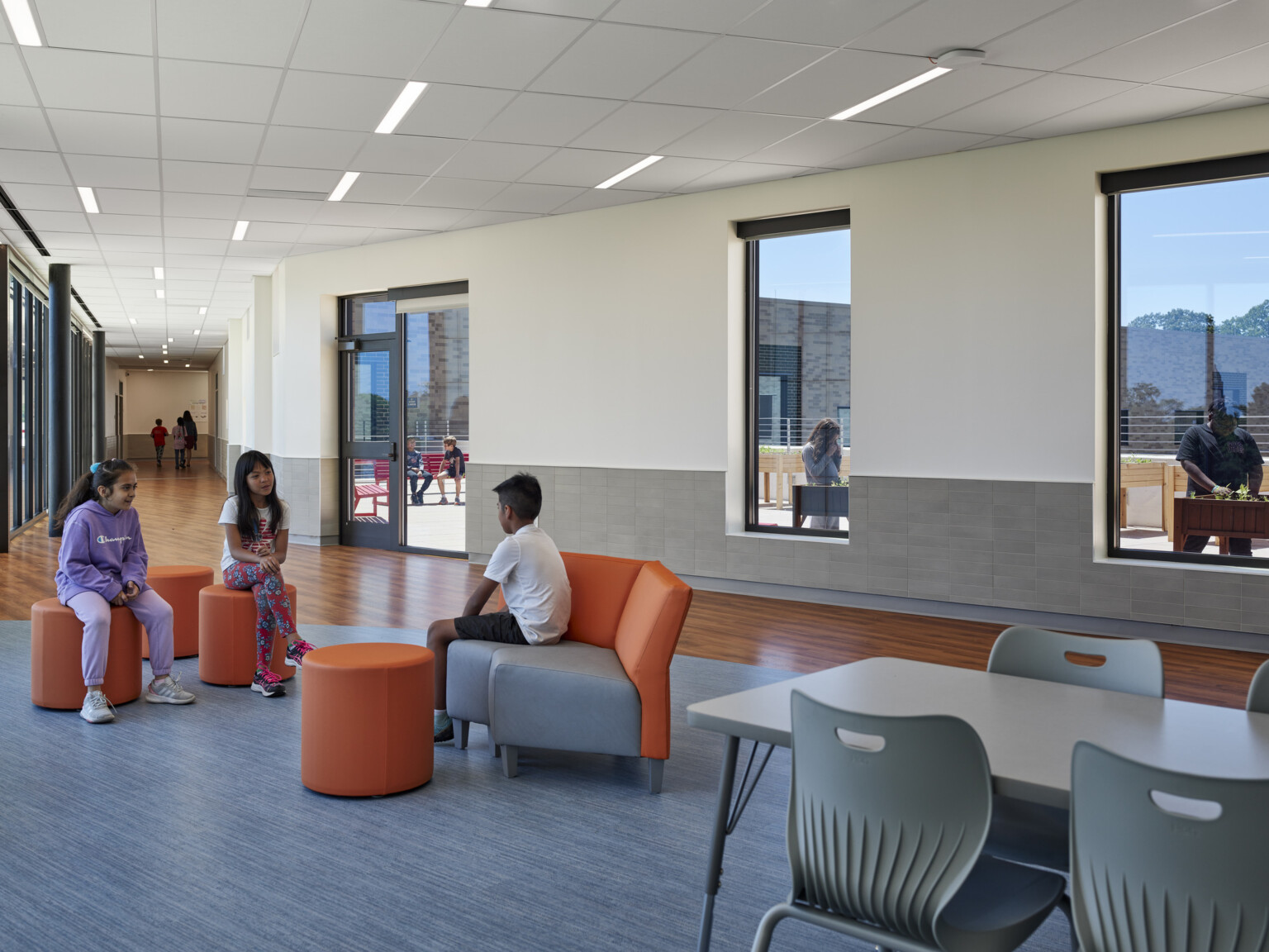 Indoor open concept learning space filled with flexible seating areas