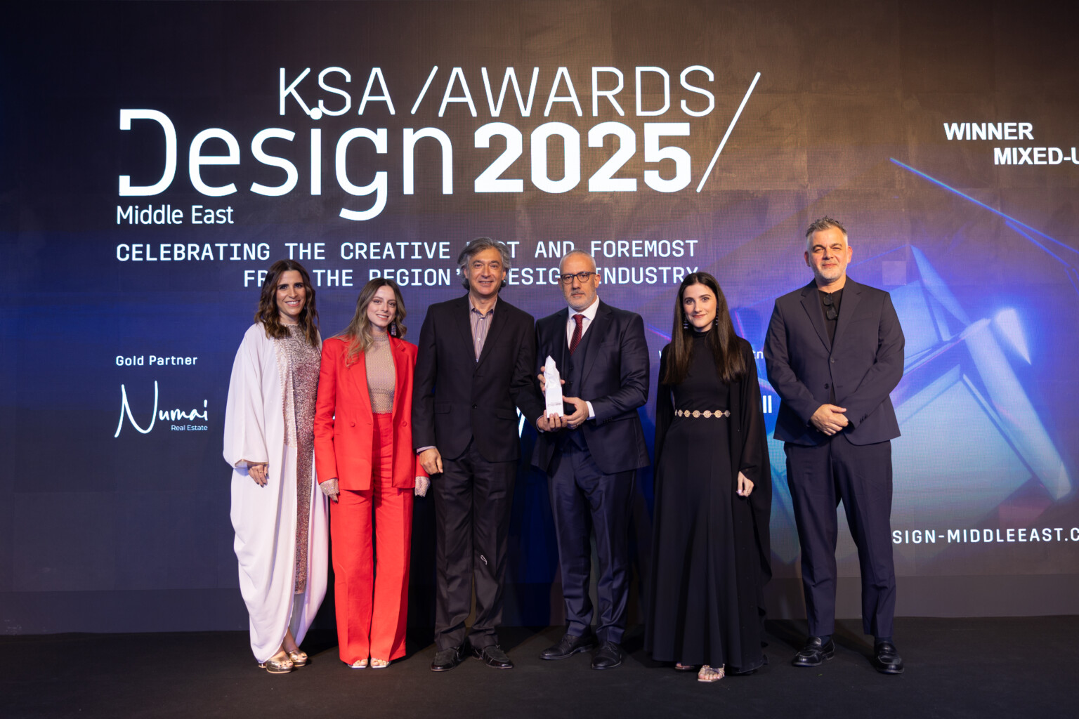 DLR Group Middle East receiving the award for Best Mixed-Use Project. DLR Group Middle East receiving the award for Best Mixed-Use Project.
