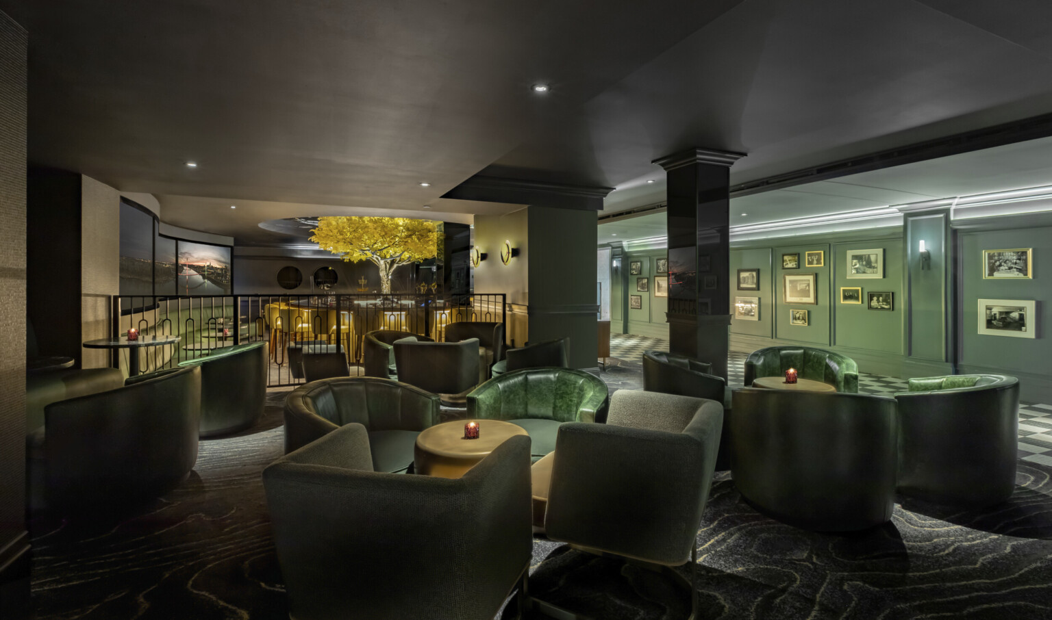 green upholster lounge seating clusters above a bar