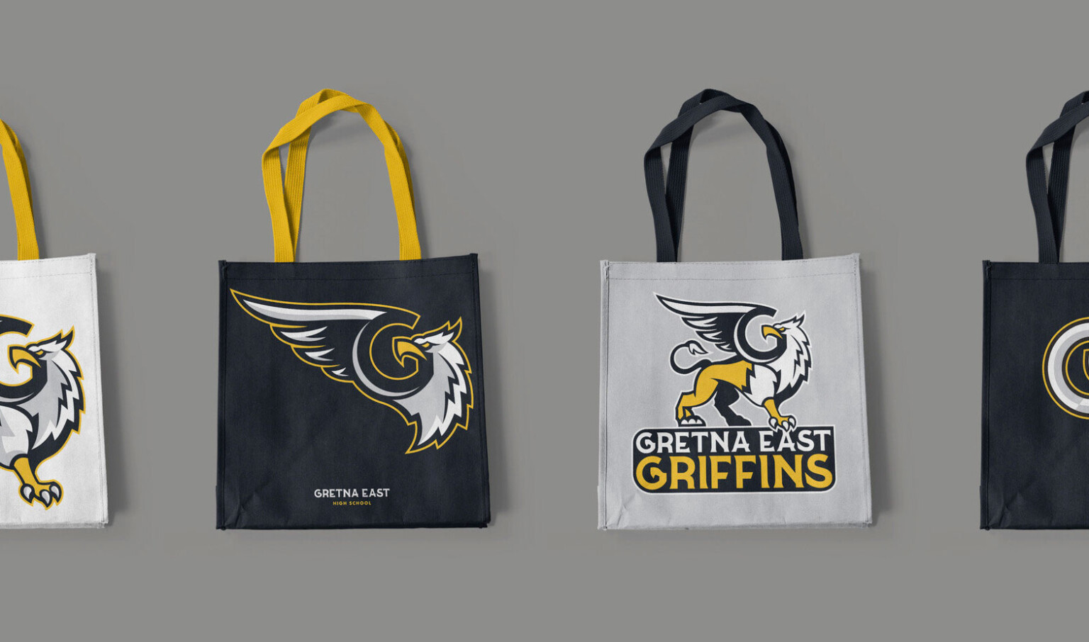 A series of 4 different tote bags in black and white with different logo treatments for the Gretna East High School Griffins