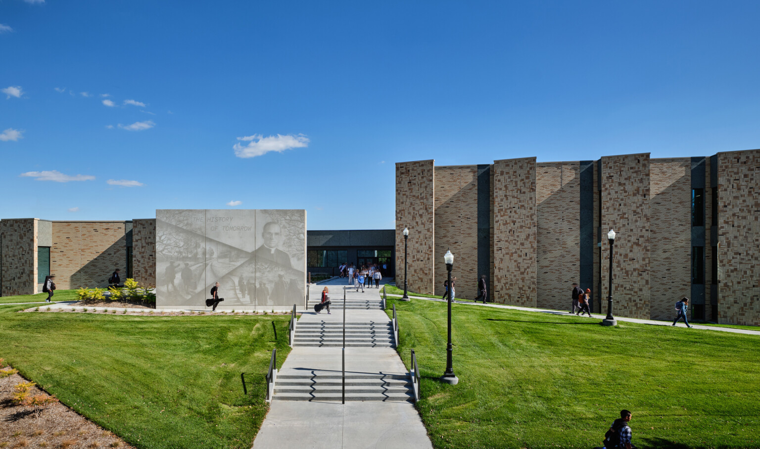 Rendering of a stone building with a mural with phrase the history of tomorrow