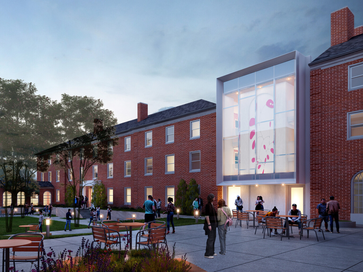 Rendering of a university campus building at dusk with large glass windows and a common area filled with tables and chairs