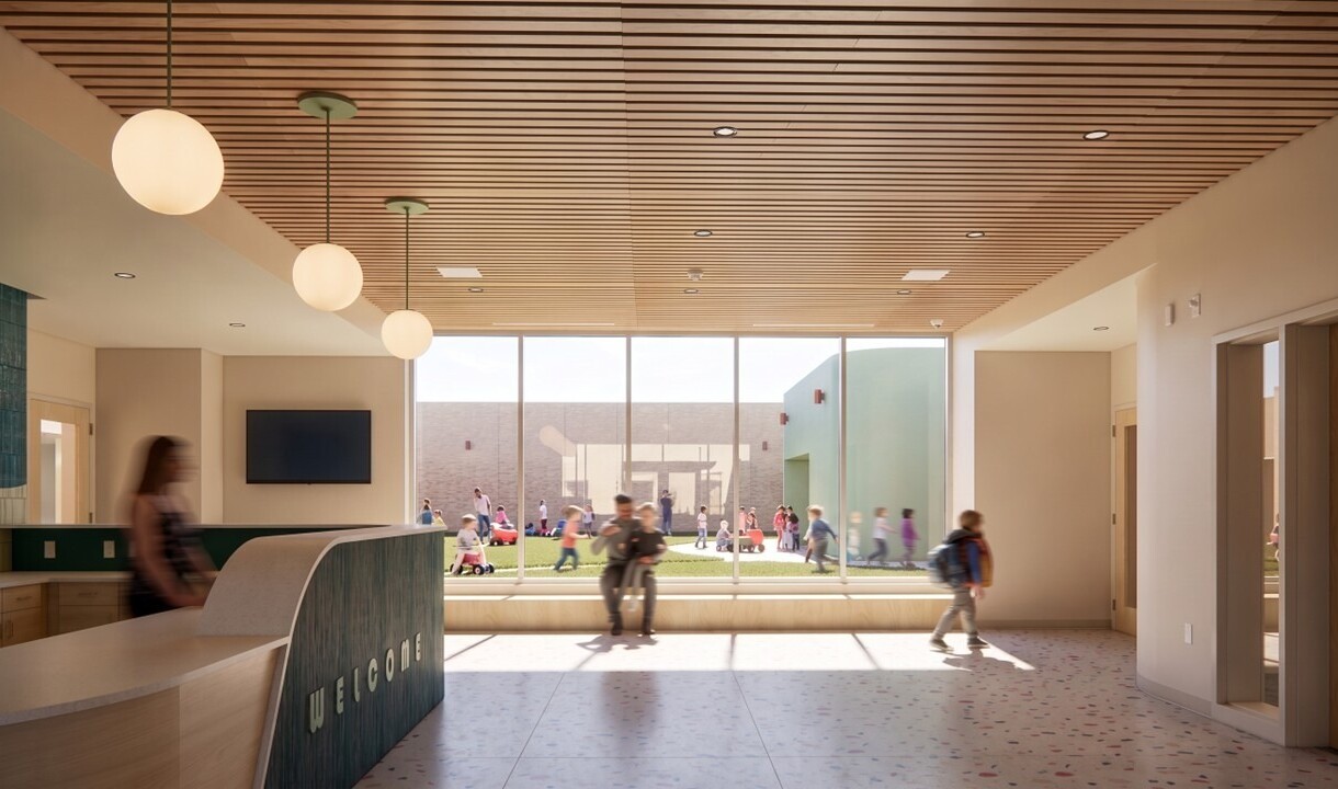 interior rendering of a modern school building; welcome desk overlooking open space and floor to ceiling walls