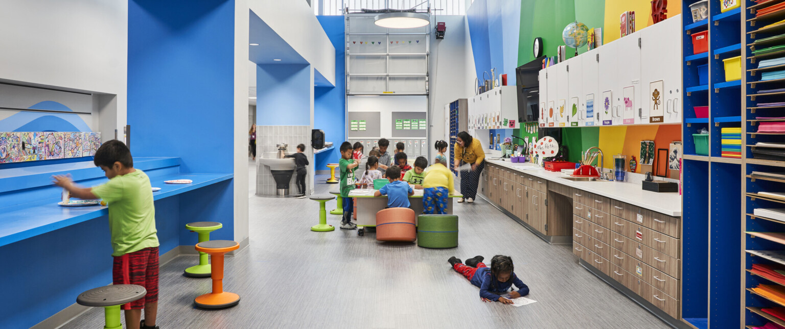 A lively classroom filled with colorful walls and furniture, creating a visually appealing environment