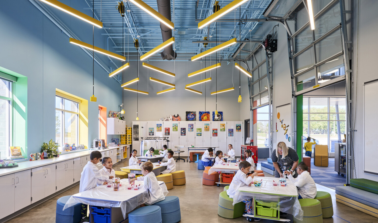 A colorful science lab is a hub of activity as kids work together to conduct experiments and discover new things.