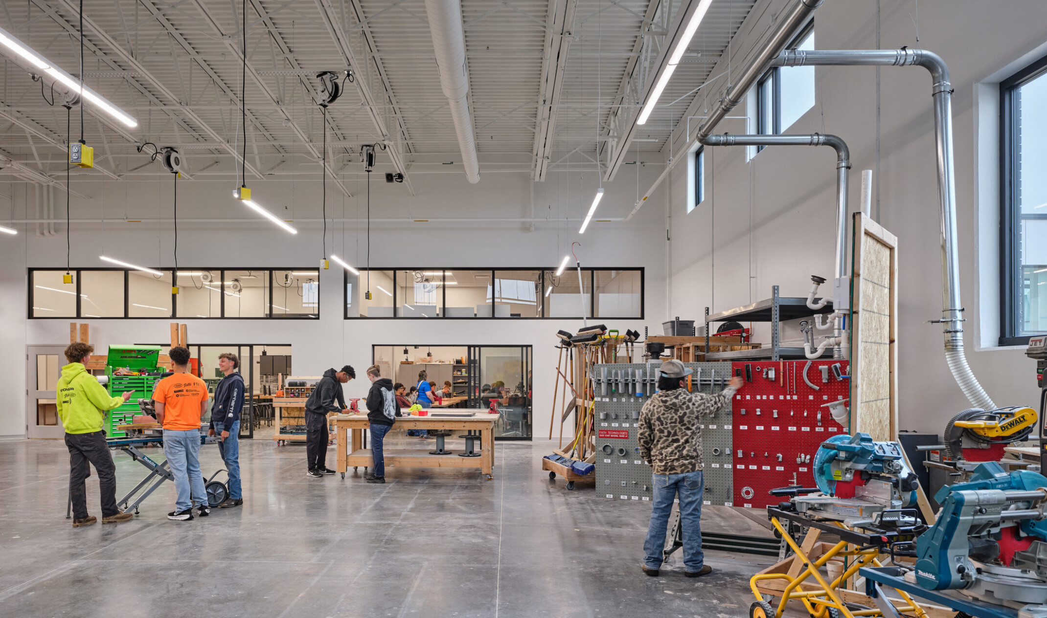 technical classroom in Olathe Innovation center; students working in a warehouse with specialized tools