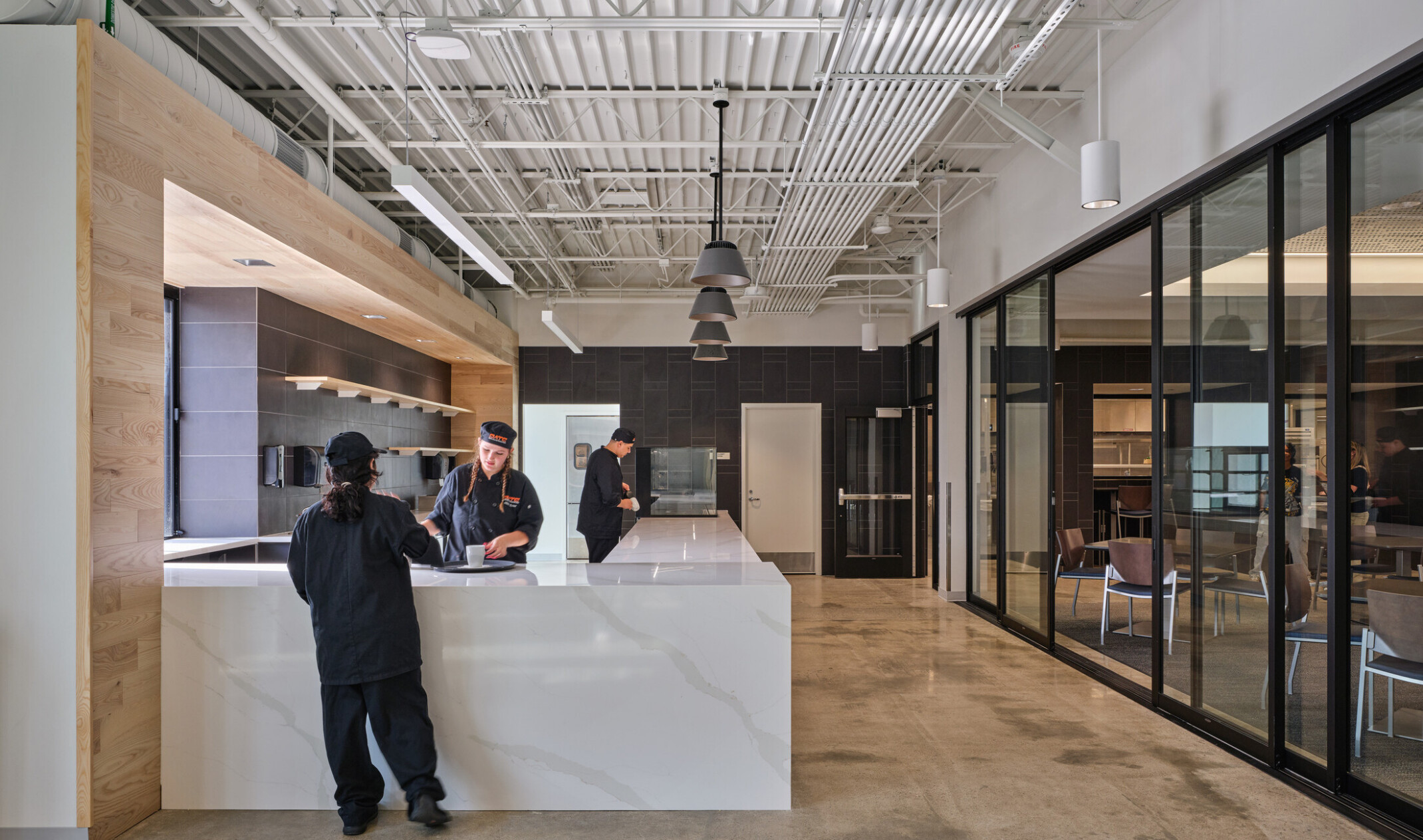 cafe in the olathe innovation center; modern barista bar with pastry case