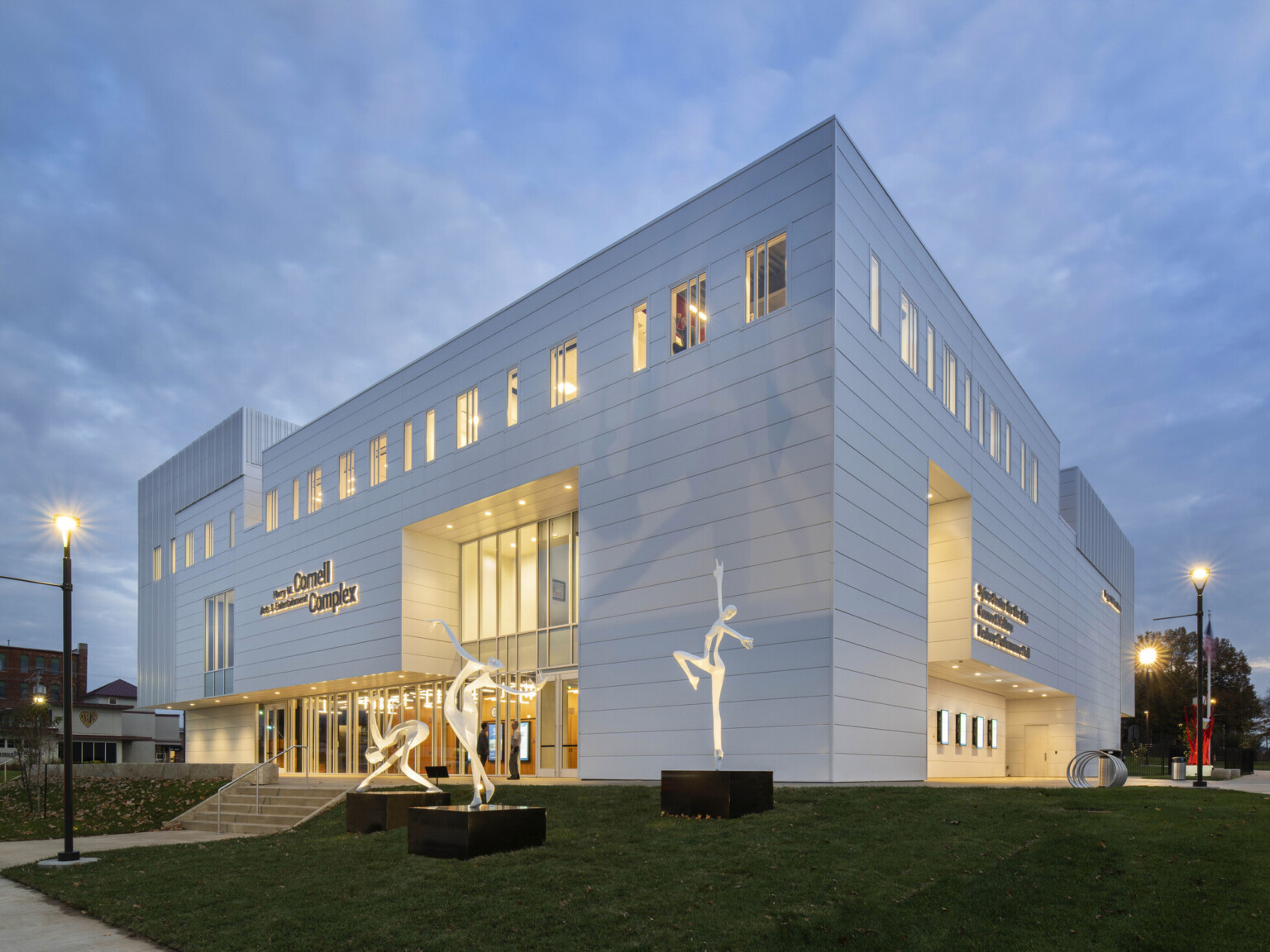 The Harry M. Cornell Arts and Entertainment Complex, a white building with recess glass, view to double height atrium The Harry M. Cornell Arts and Entertainment Complex, a white building with recess glass, view to double height atrium