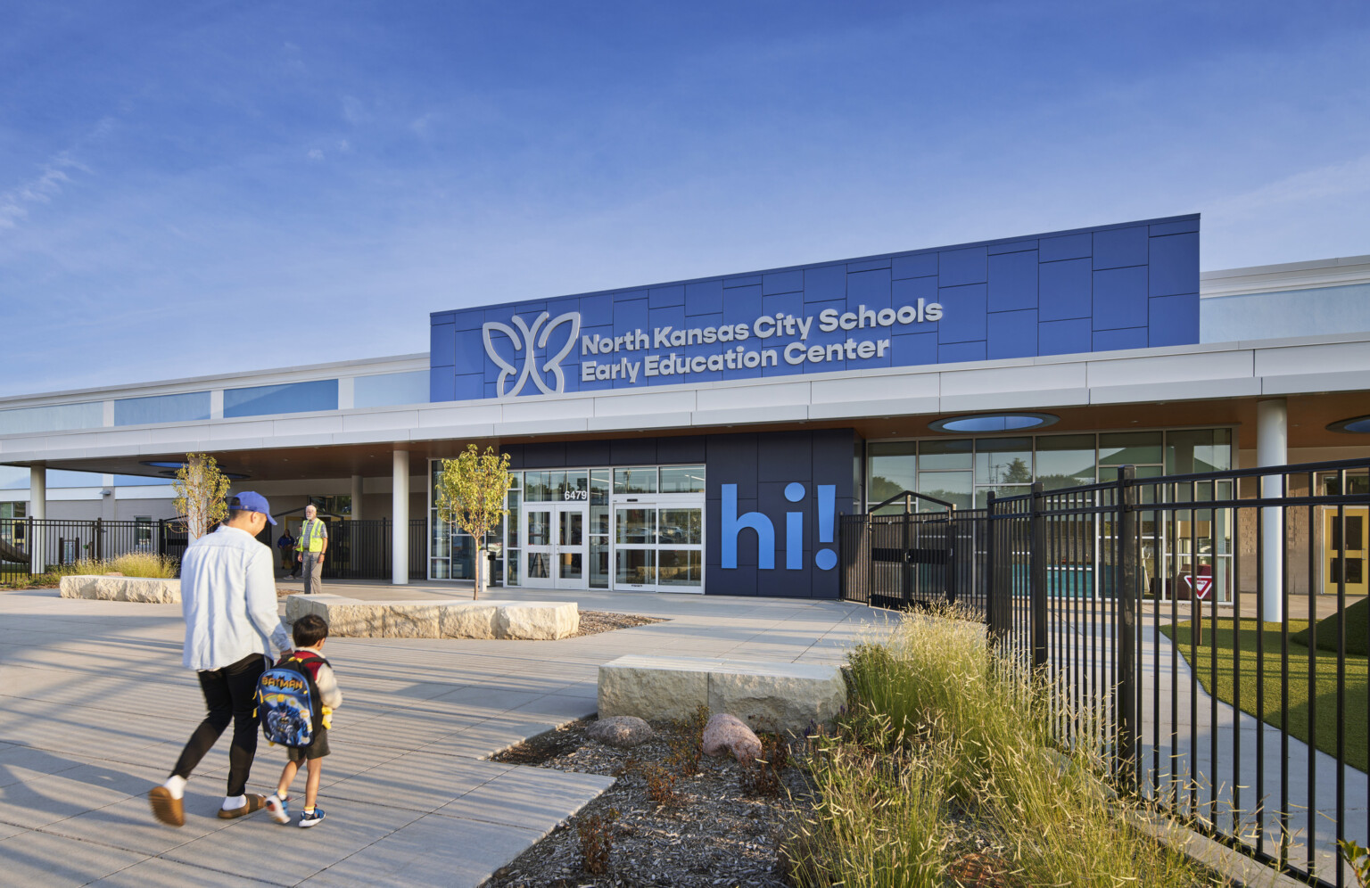North Kansas City School Early Education Center exterior, a two tone blue facade, large "Hi!" mural by entry