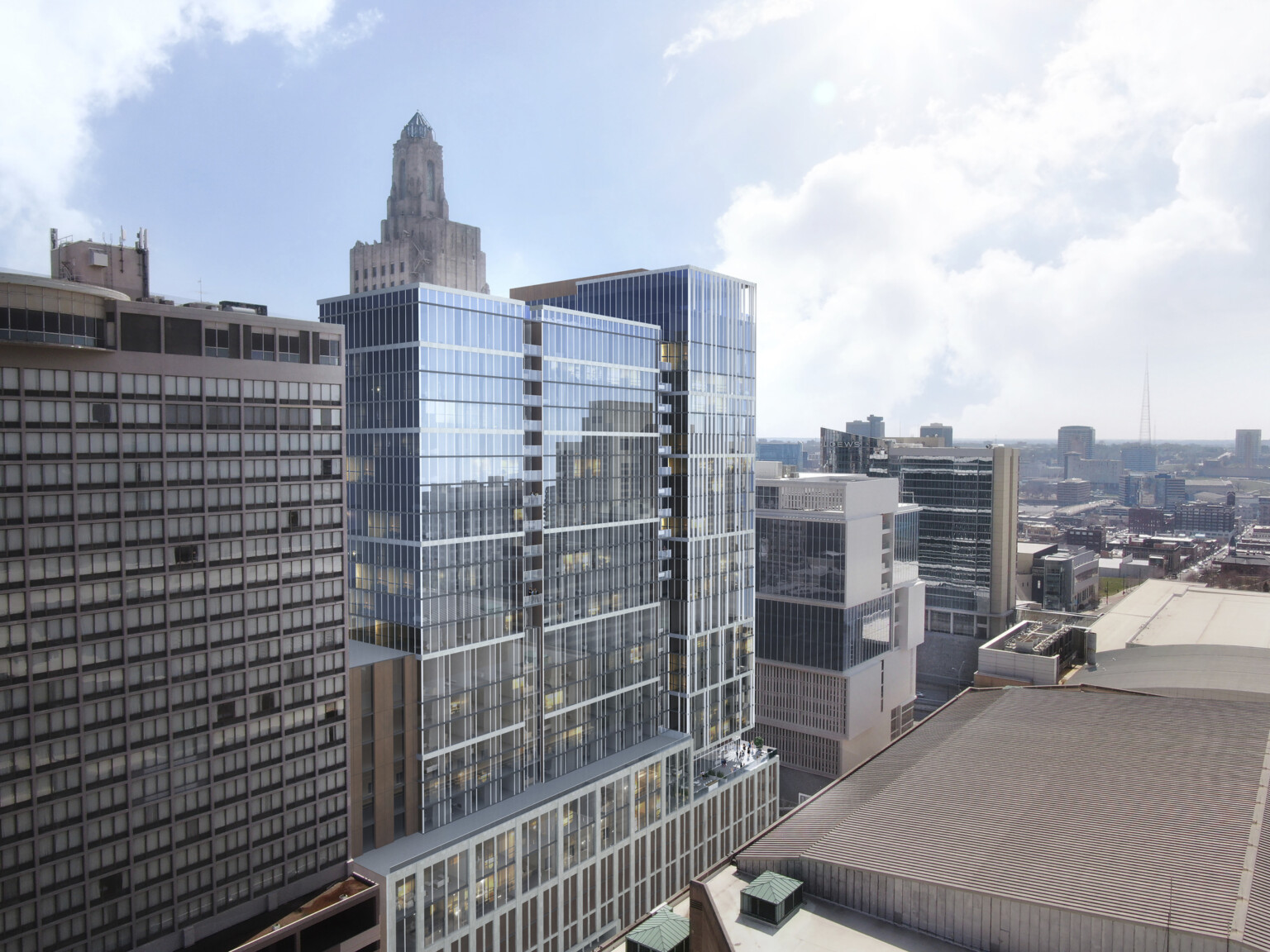 Sideview of new 27-story mixed-use high-rise clad in limestone-colored panels and glass façade