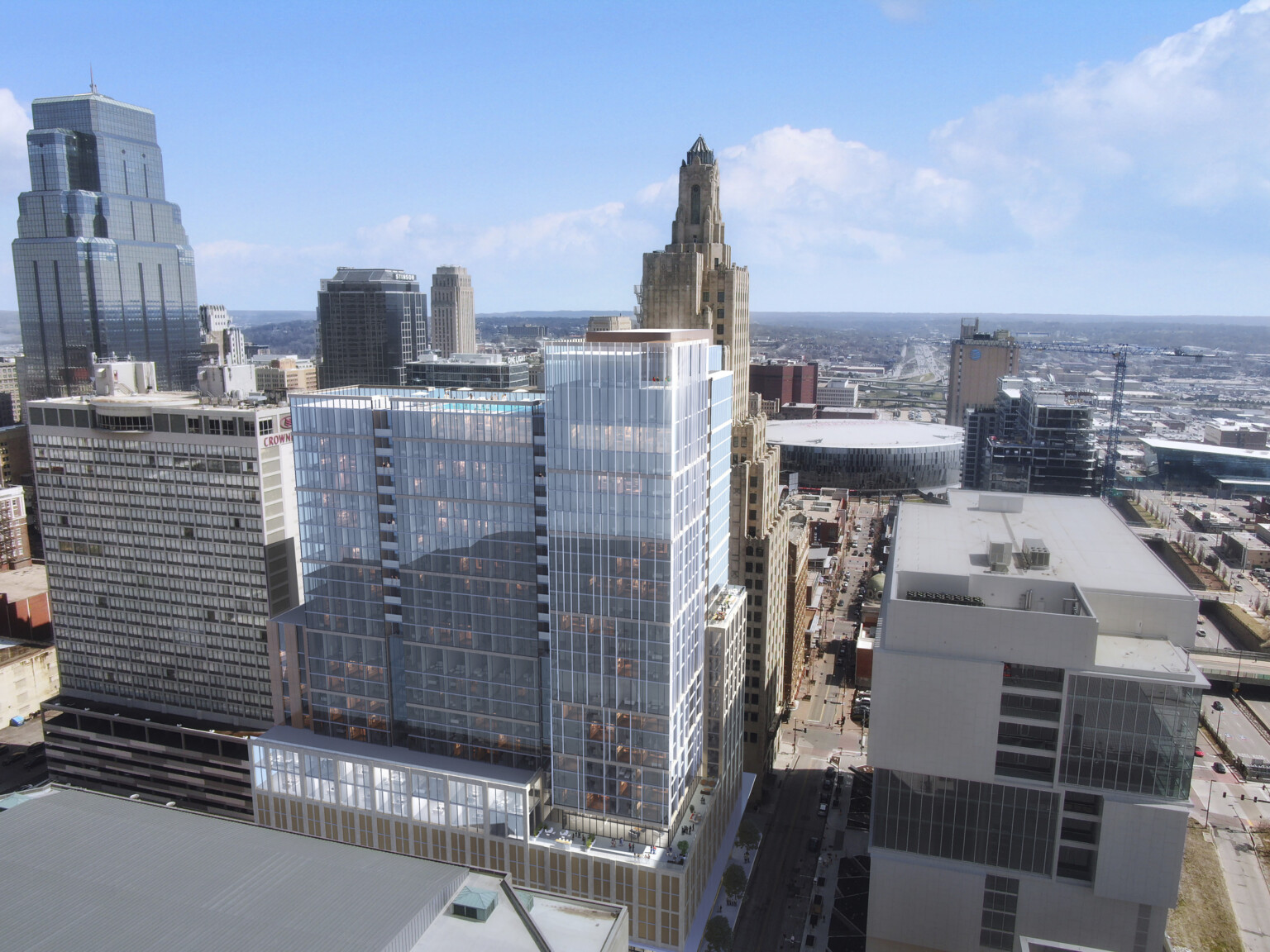Viewed from backside of new 27-story mixed-use high-rise clad in limestone-colored panels and glass façade