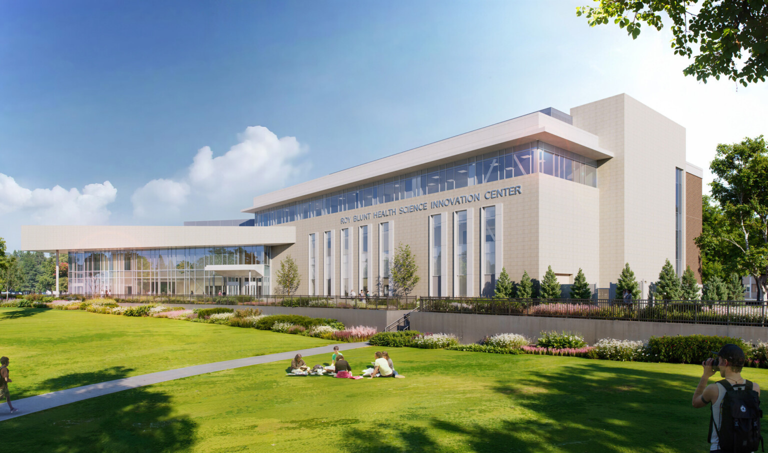 exterior design concept for new innovation center at missouri southern state university; large campus lawn; multi-story modern building housing simulation center