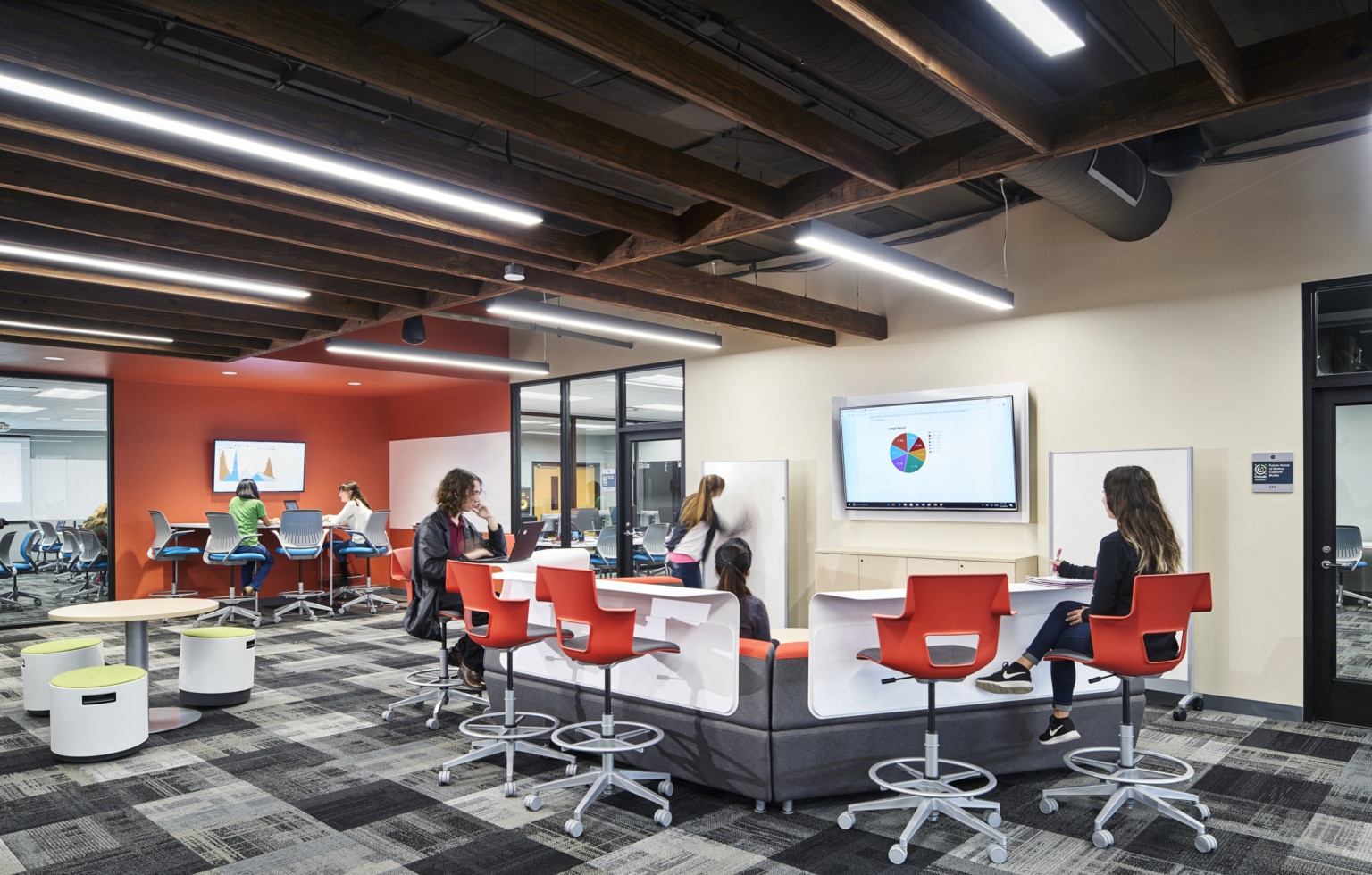 Johnson County Community College collab center. The student collaboration floor with breakout pods and technology Johnson County Community College collab center. The student collaboration floor with breakout pods and technology