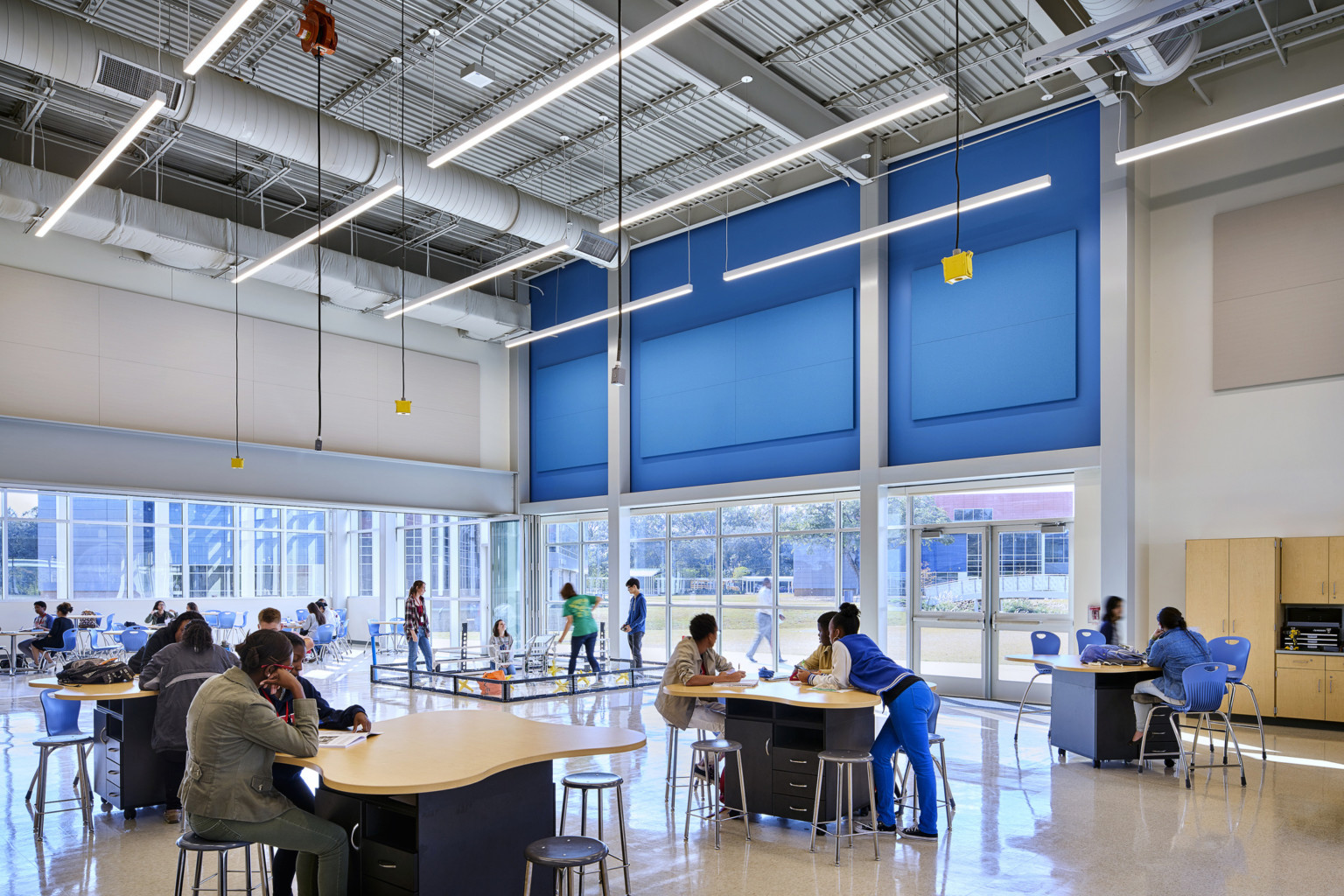 Large double height learning space in East Baton Rouge Liberty High School with drop power and a robotics ring for students