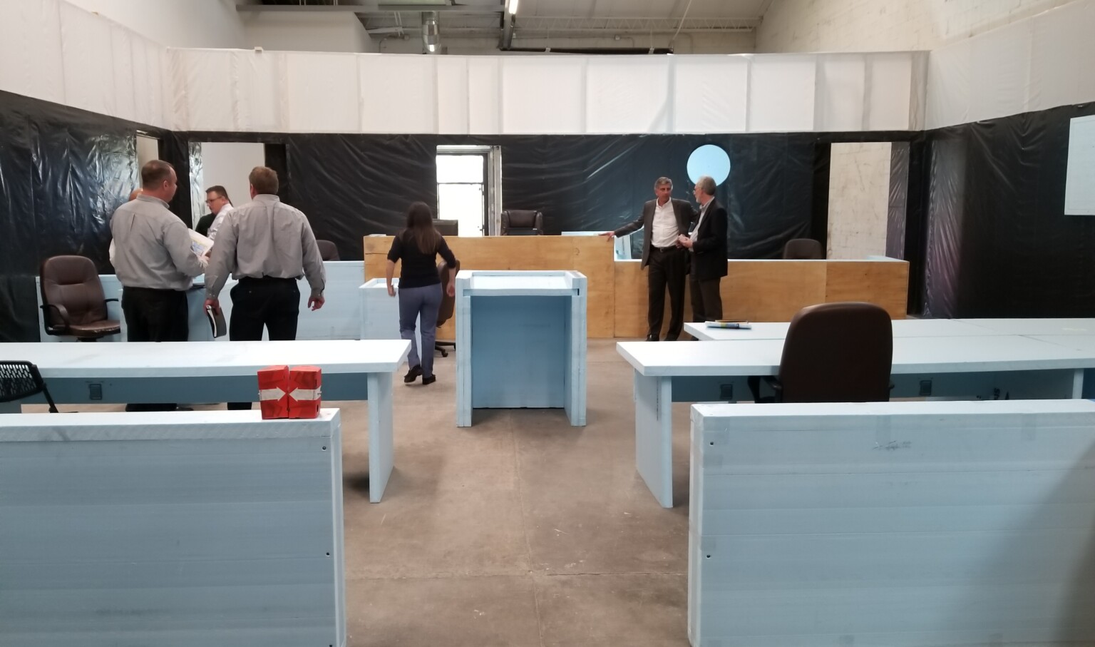 functional mockup of courtroom with people studying the space functional mockup of courtroom with people studying the space