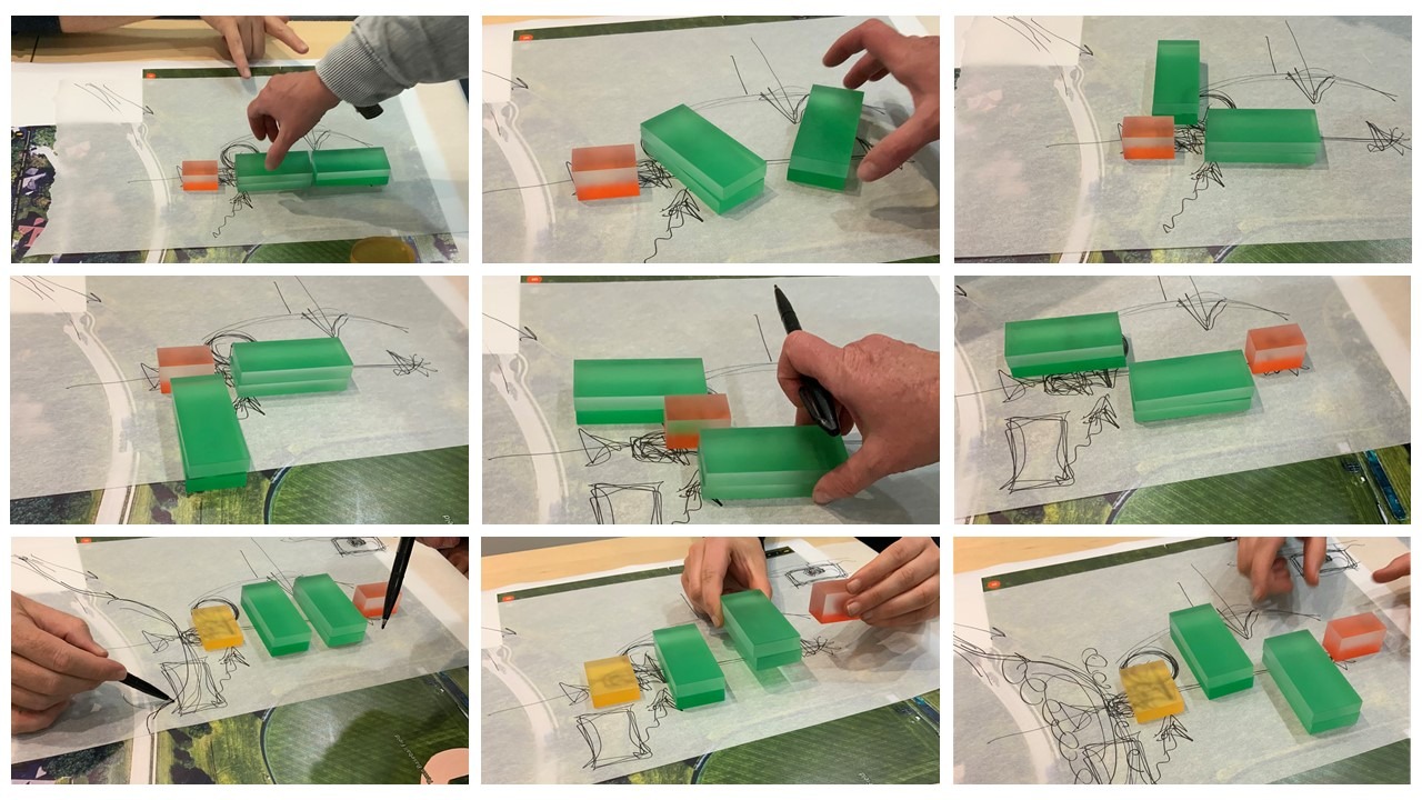 2 people stacking blocks in different parts of a rendering to simulate different potential design solutions