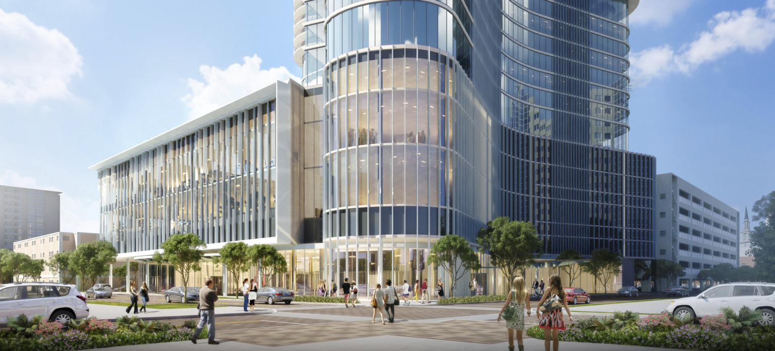 The Summa Orlando Hotel and Mixed Use Tower seen from the front, the glass lined building curved to rounded entry