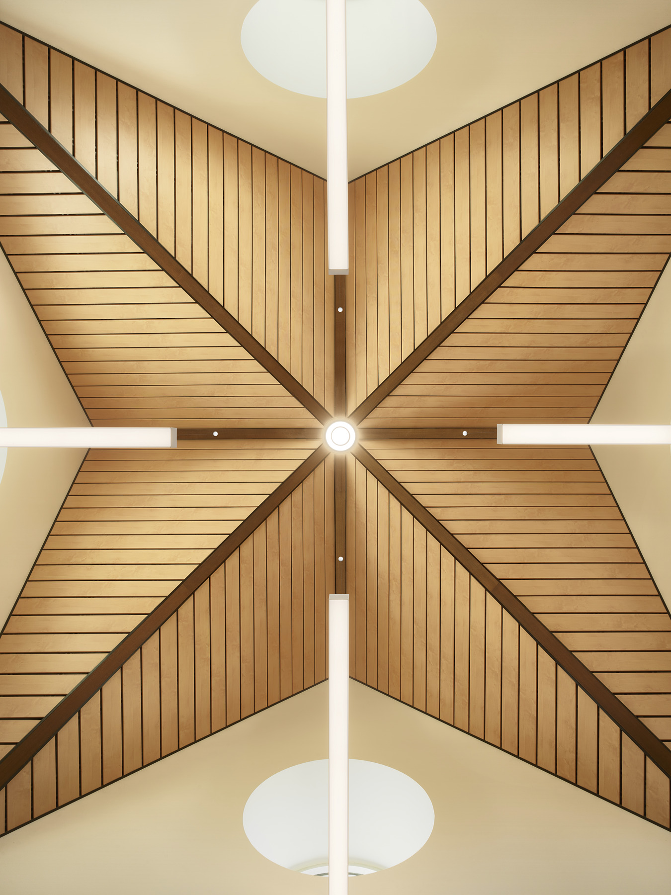 Wood ceiling detail at the Madonna Rehabilitation Center closeup. 8 triangular segments in pairs come to center circle light