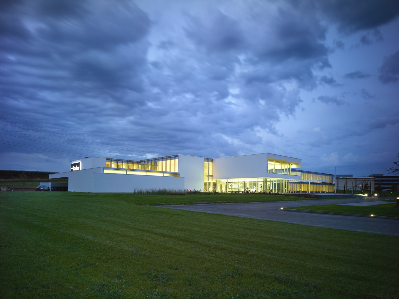 Parker Hannifin European Headquarters, a 2 story building with white wrapped facade around large floor to ceiling windows