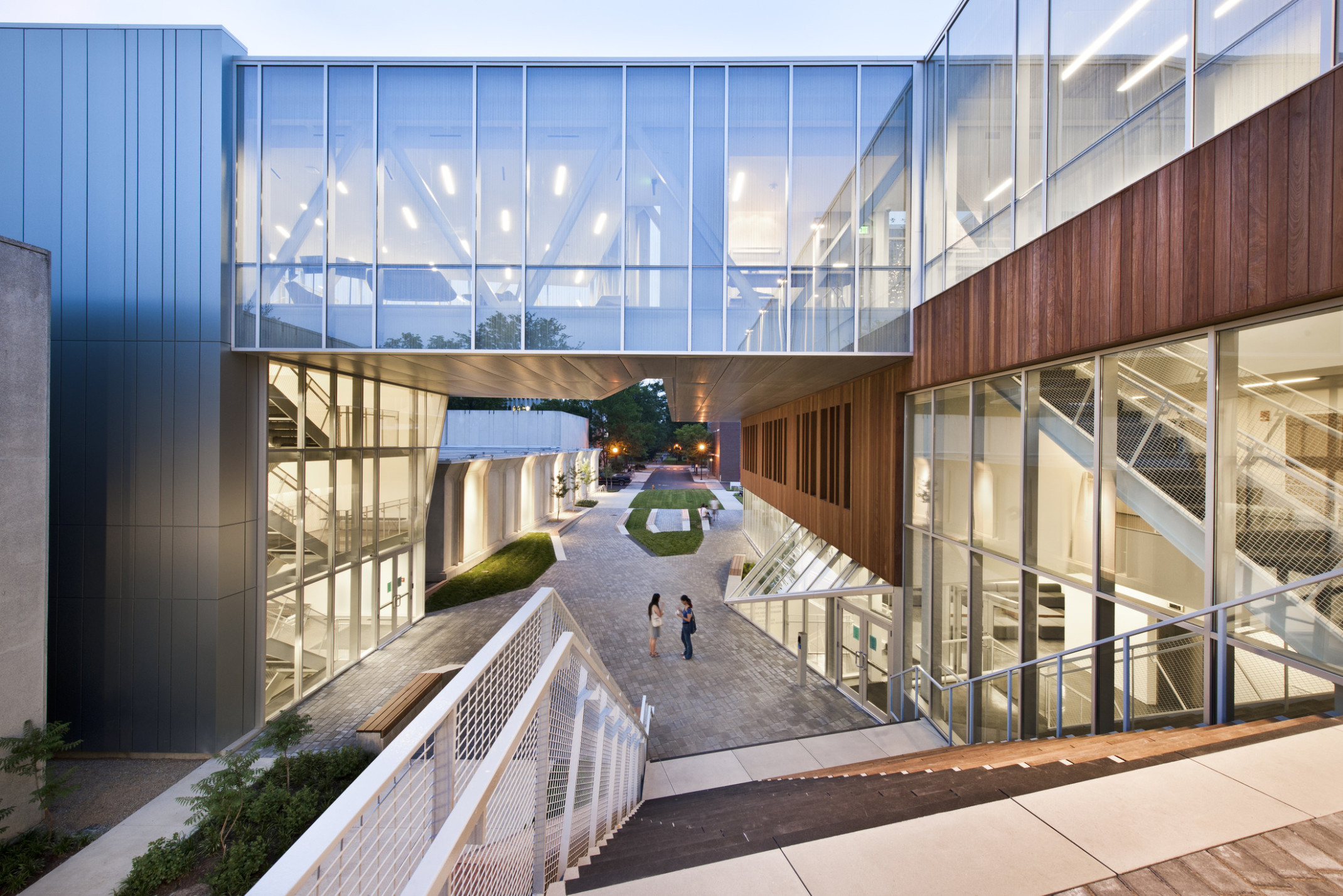 Campus plaza at Oberlin College seen from top of the stairs looking down to walkway under 4th floor skywalk