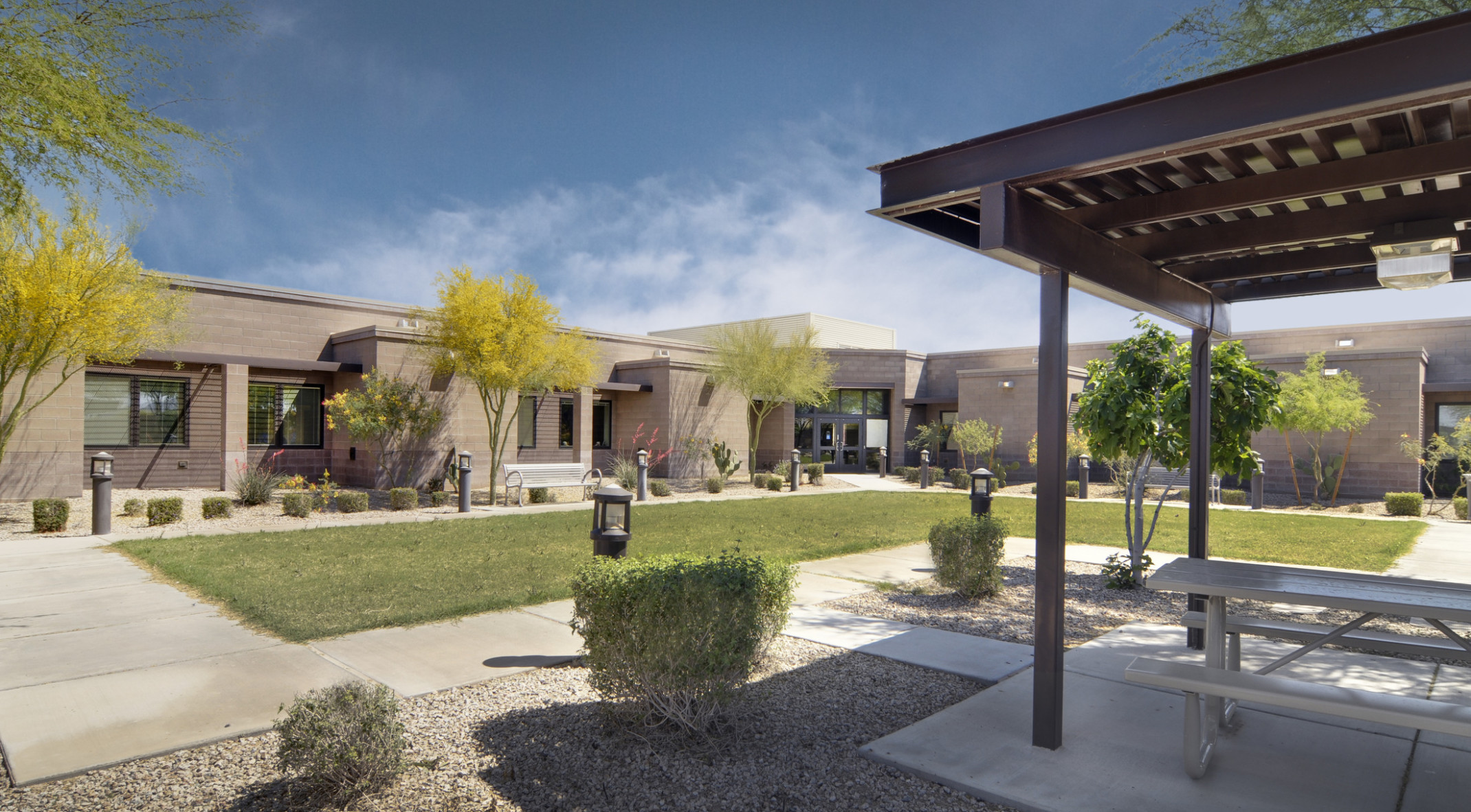 Rendering of Gila River Skilled Nursing Facility stone exterior viewed from courtyard