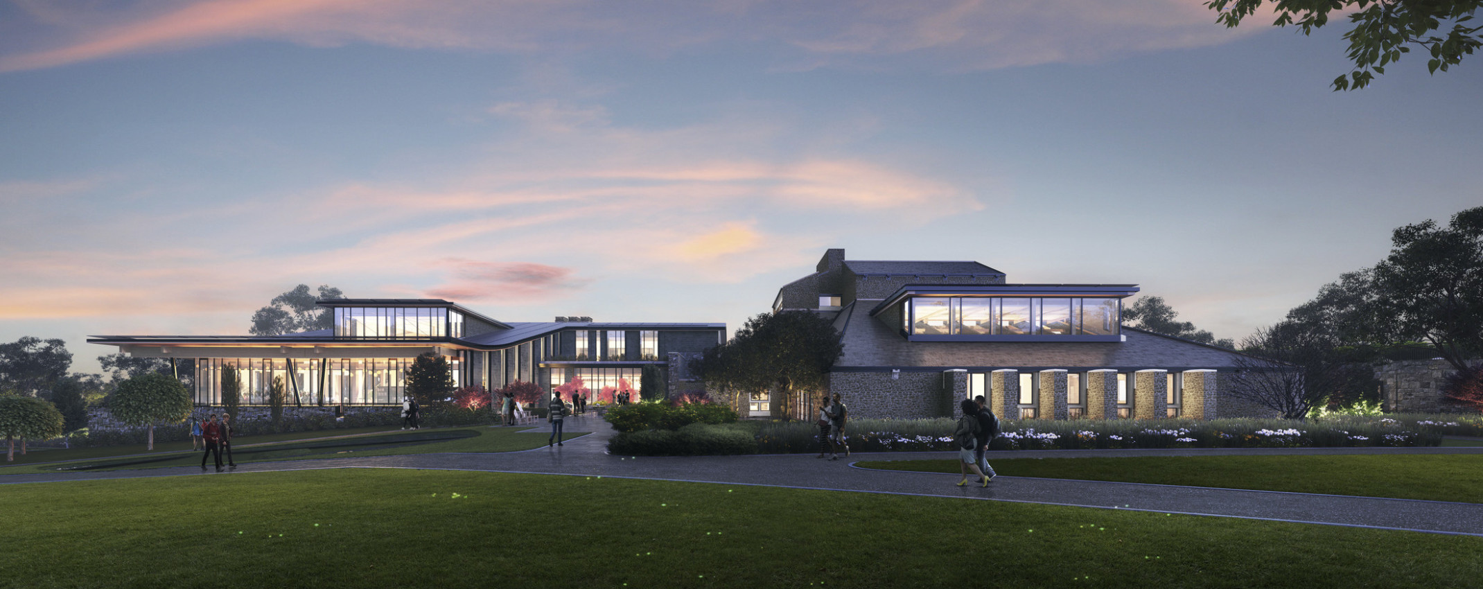 Swarthmore College Dining and Community Commons front entry illuminated from within in the evening