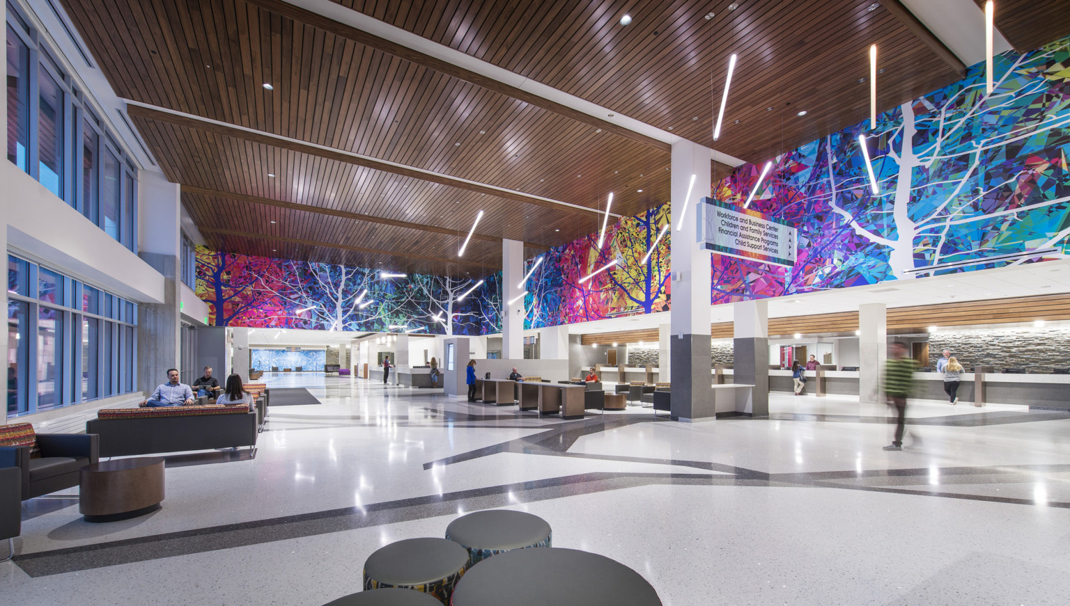 Colorful mural surrounds upper lobby wall in Adams County Pete Mirelez Human Services Center