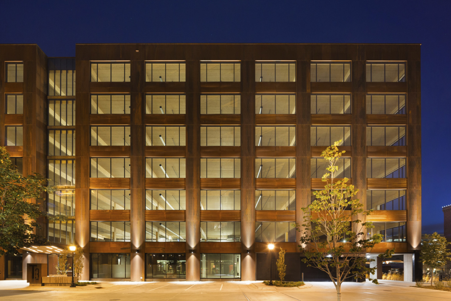 Hines T3 Partnership building in Minneapolis, a mass timber midrise building illuminated at night, mass timber buildings, t3 design, mass timber high rise, t3 construction, t3 partners