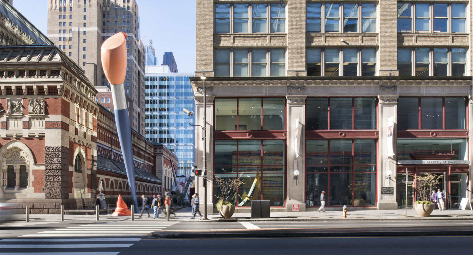 street view of Pennsylvania Academy of the Fine Arts building with two story blue and orange paint brush sculpture outside street view of Pennsylvania Academy of the Fine Arts building with two story blue and orange paint brush sculpture outside