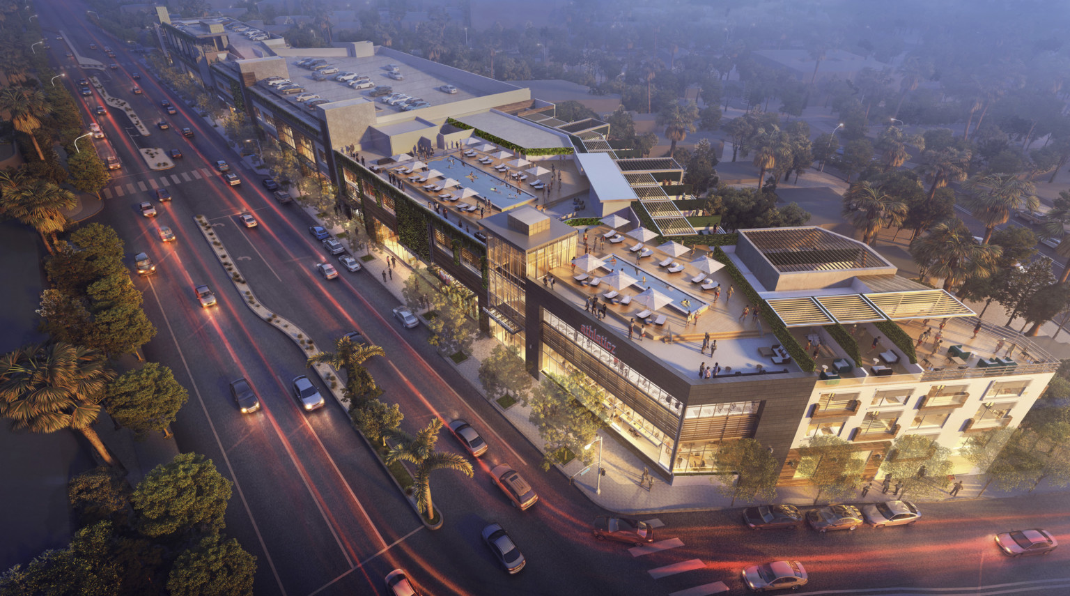 Aerial view of 8600 Santa Monica Blvd. Rooftop pools and partially covered patios above white and brown 3 story building