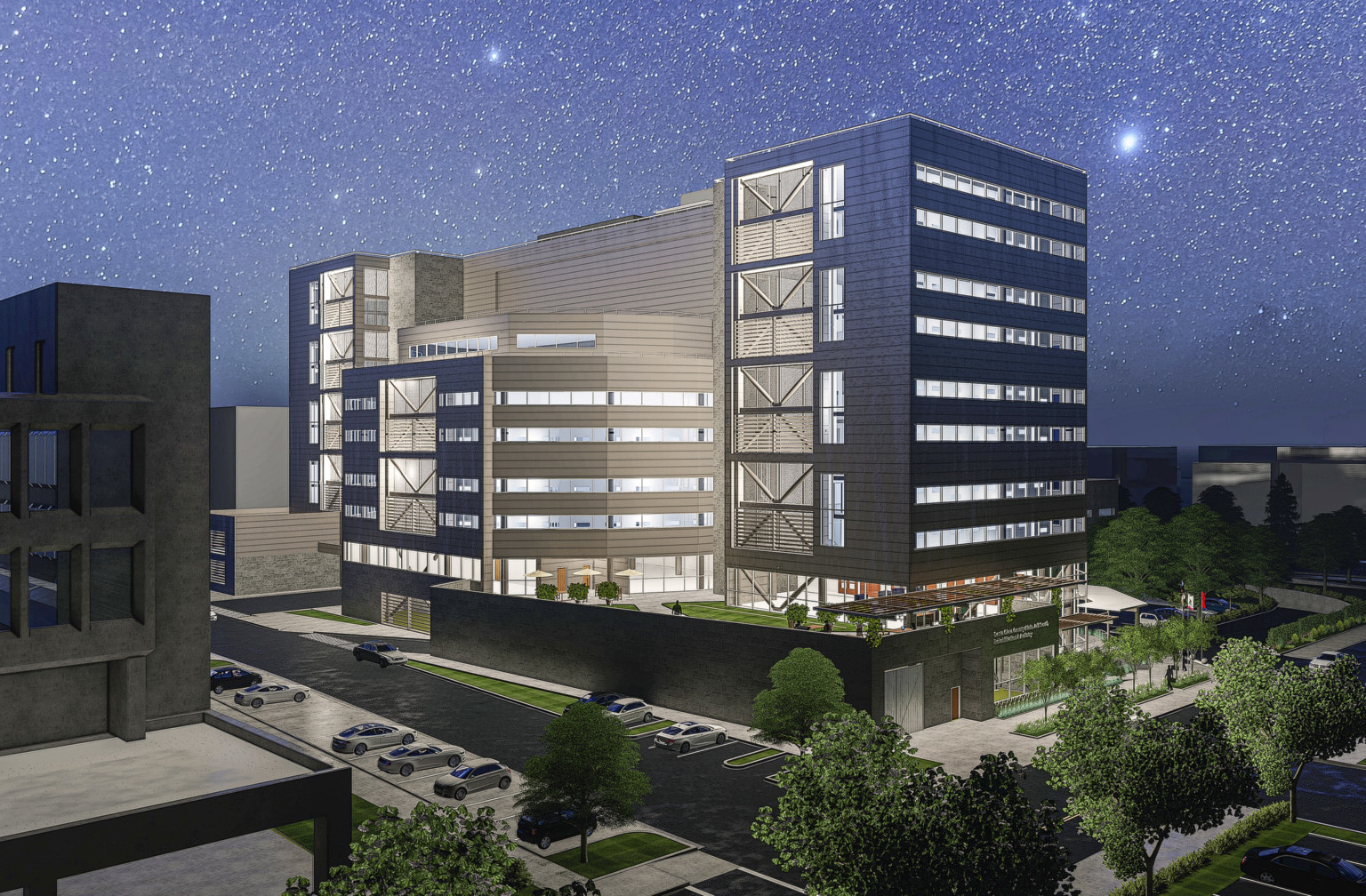 The Santa Clara County South Treatment and Re-entry Facility complex with large windows and grey facade illuminated at night