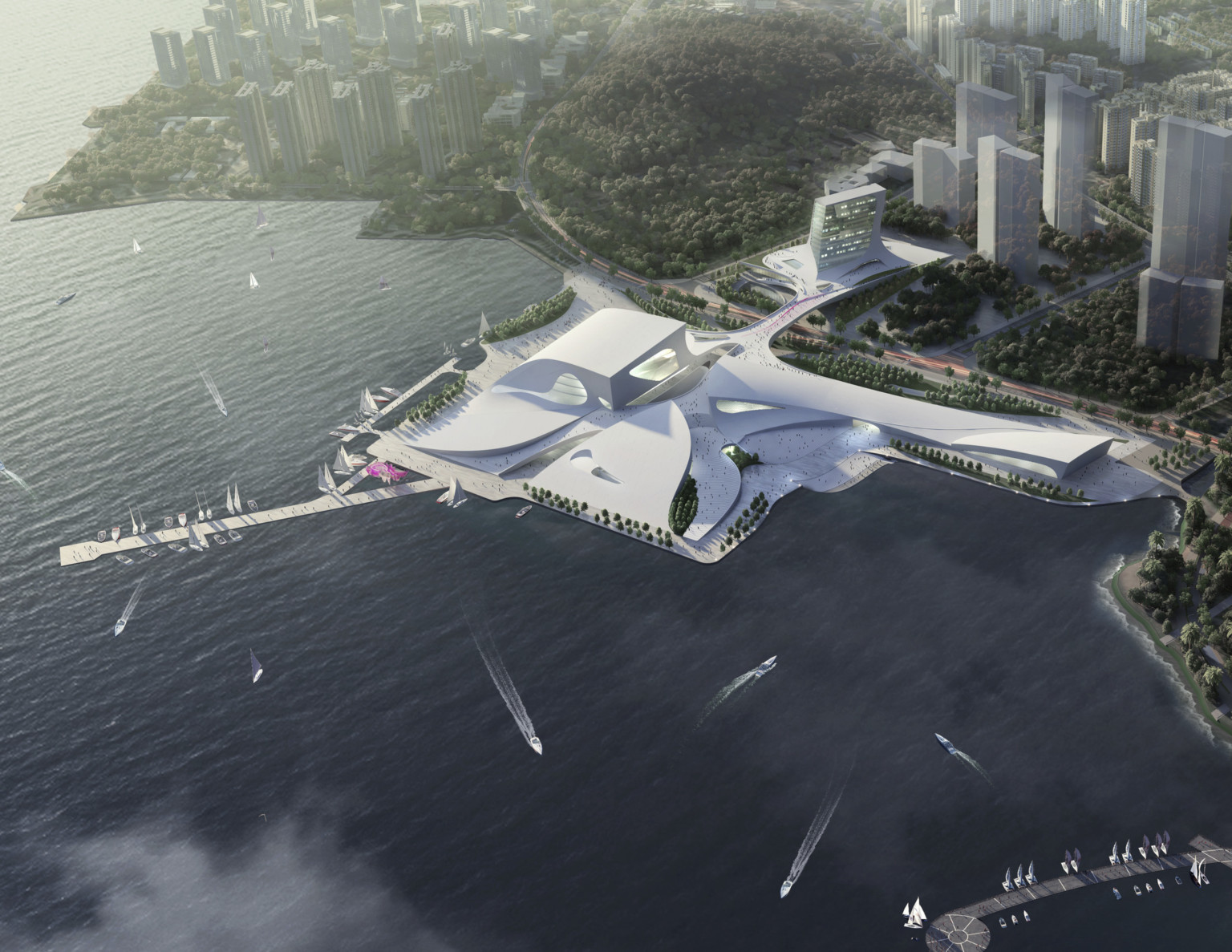 Aerial view of the sloping white Shenzhen Opera house between the Shenzhen Bay and Shekou Mountains