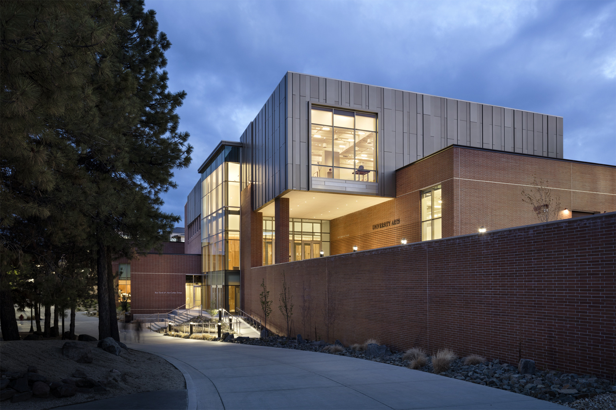 Exterior view of the University of Nevada, Reno University Arts Building lit in the evening