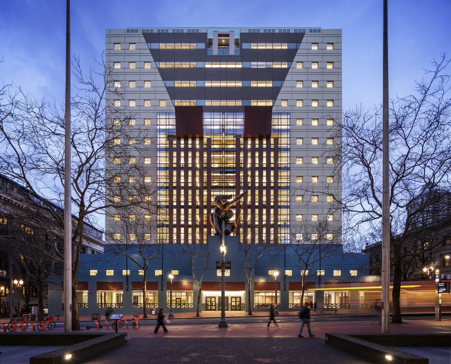 The Portland Building illuminated at dusk following renovation