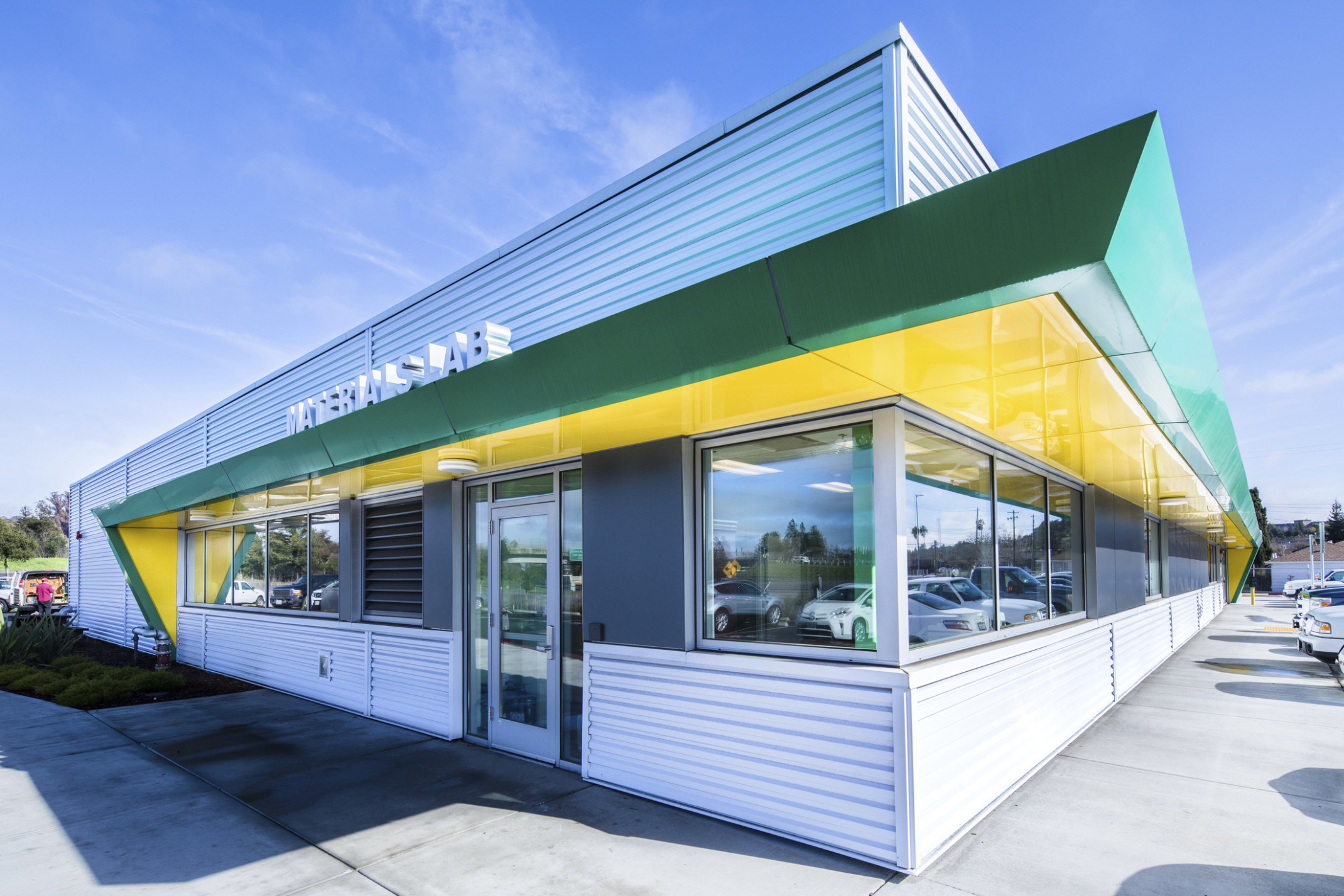 Sonoma County Fleet Maintenance and Soils Testing Lab Building corner view with green and yellow awning over silver panels
