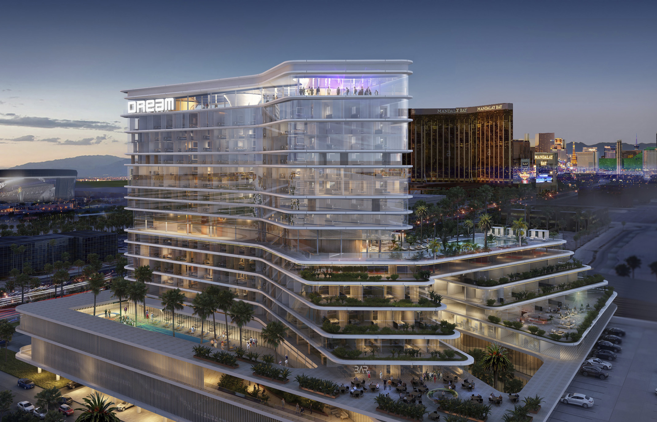 Hotel viewed from corner from above. Stepped balconies extend in two angled directions, shading lower levels
