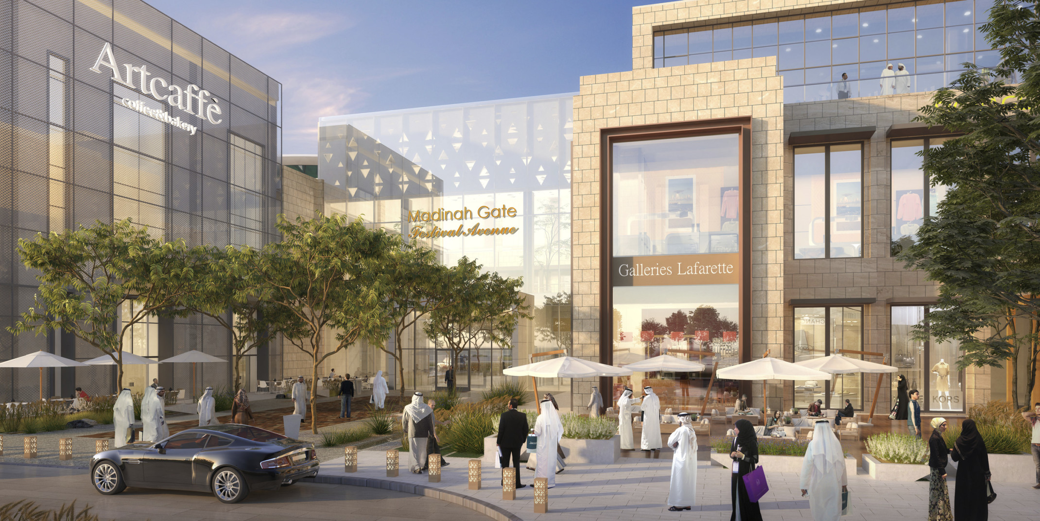 Madinah Gate, a glass and light stone mixed use building with gold accents. In front, tables with white umbrellas and chairs Madinah Gate, a glass and light stone mixed use building with gold accents. In front, tables with white umbrellas and chairs