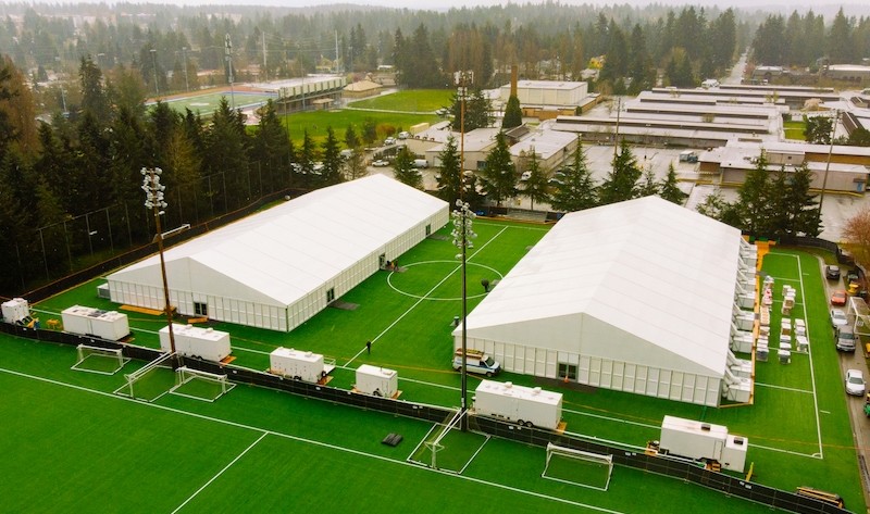 COVID 19 pop up facility with tents on soccer field