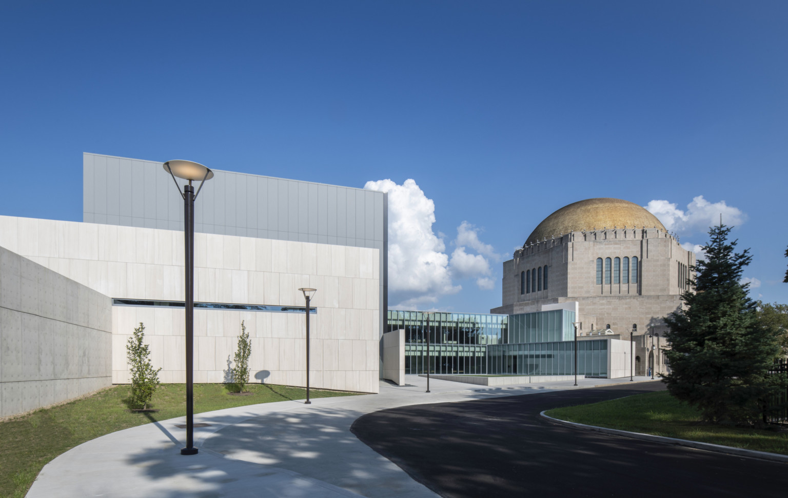 Front entrance of concrete and glass geometric addition to the historic dome temple at Case Western Reserve University