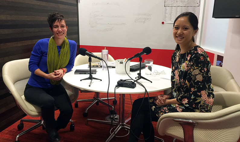 Catherine Meng and Taryn Kinney sit in a small room with microphones on the table in front of them