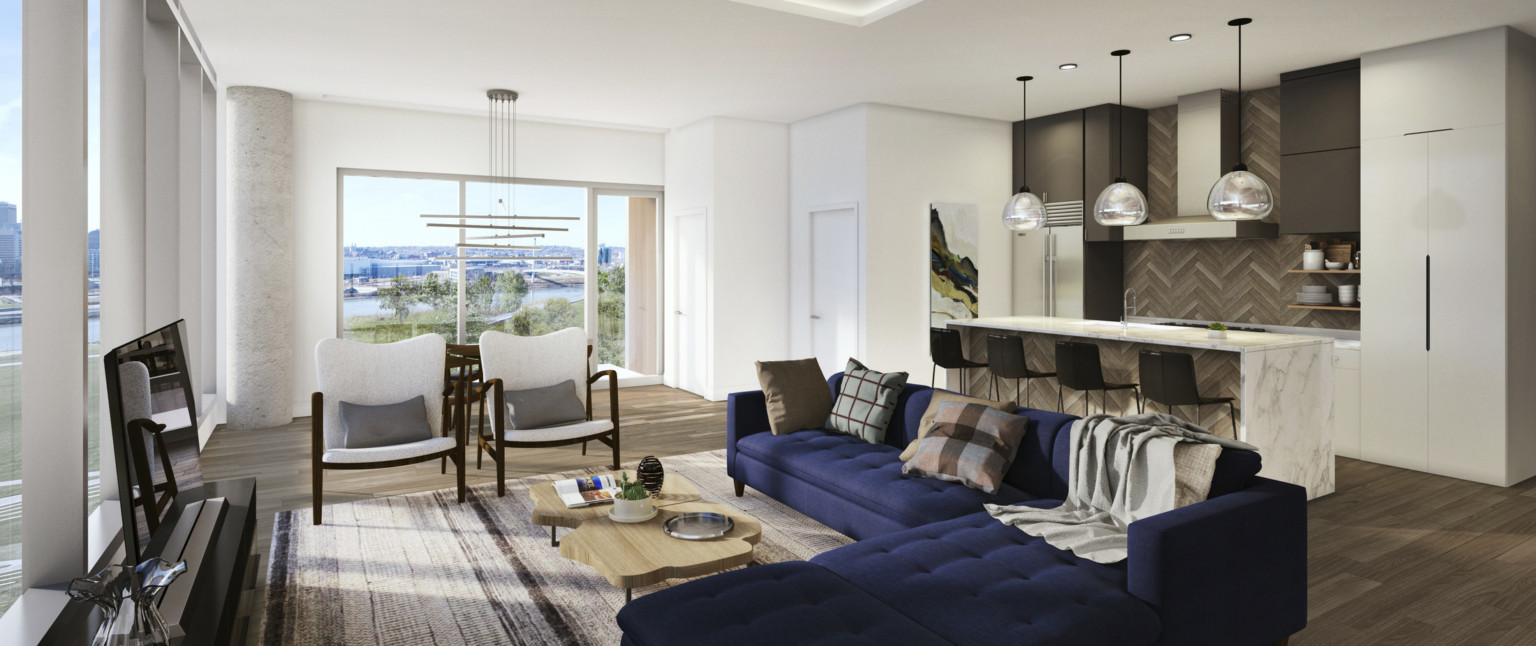 Open floorplan kitchen with marble island and wood panel accents opens to living room seating. Back, floor to ceiling windows