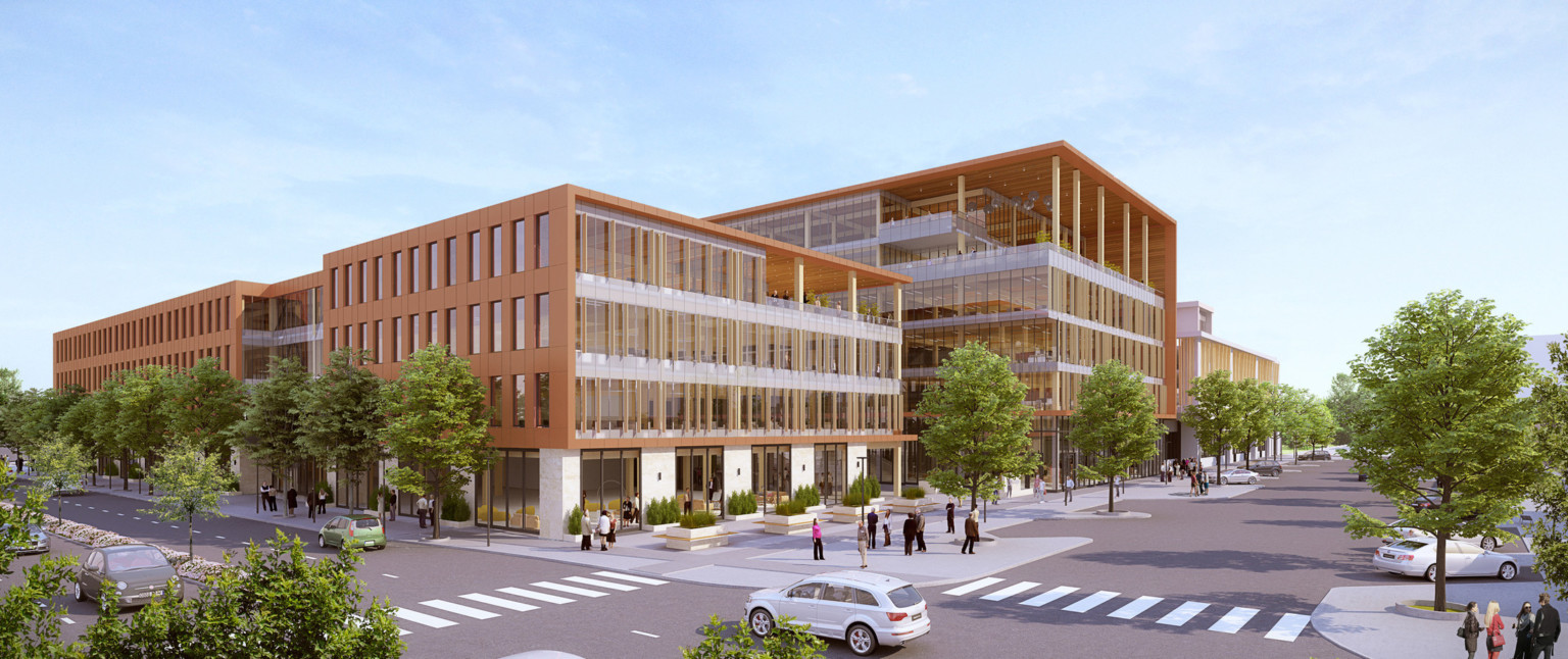 Corner view of development with glass walls, right, and orange wrapped facade, top and left. Covered patios on upper corners