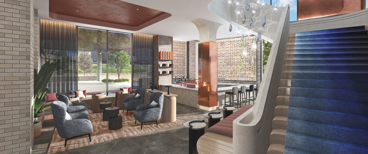 Flexible seating area to the side of blue carpeted grand staircase. Bar in the corner with exposed brick and metallic column