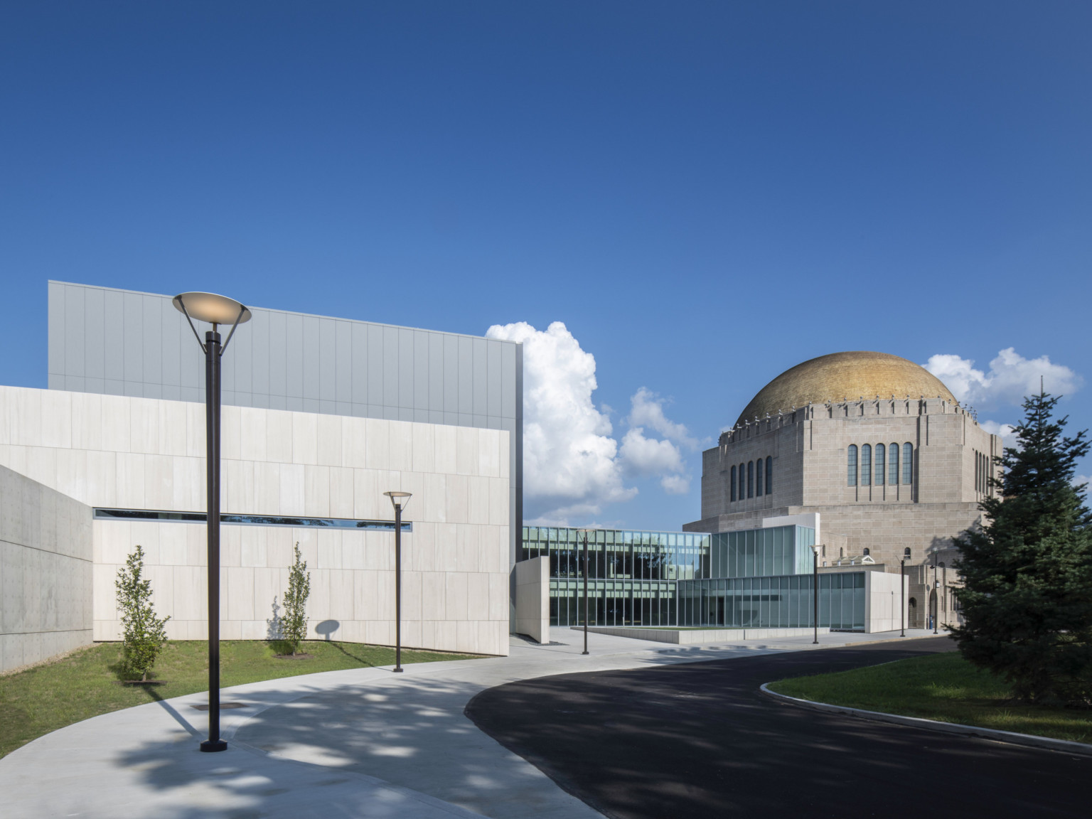 Front entrance of concrete and glass geometric addition to the historic dome temple at Case Western Reserve University