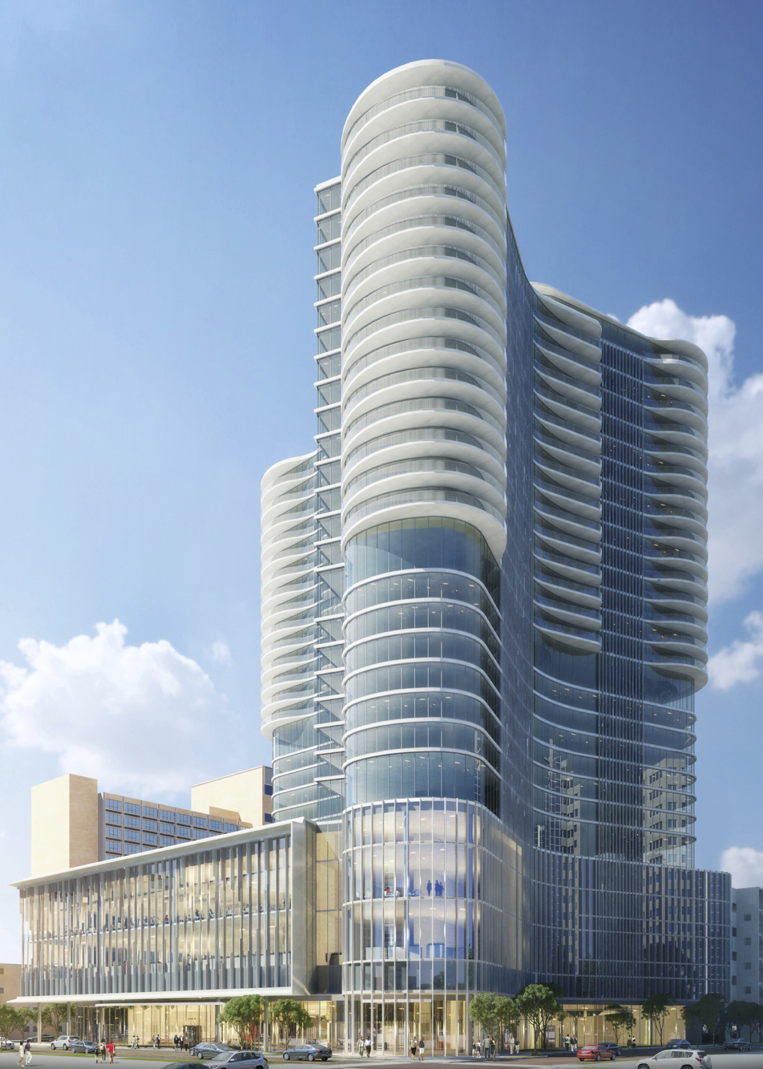 Front view of 33 story glass building with shaded upper balconies and rounded tower at front. Right wall curves into building