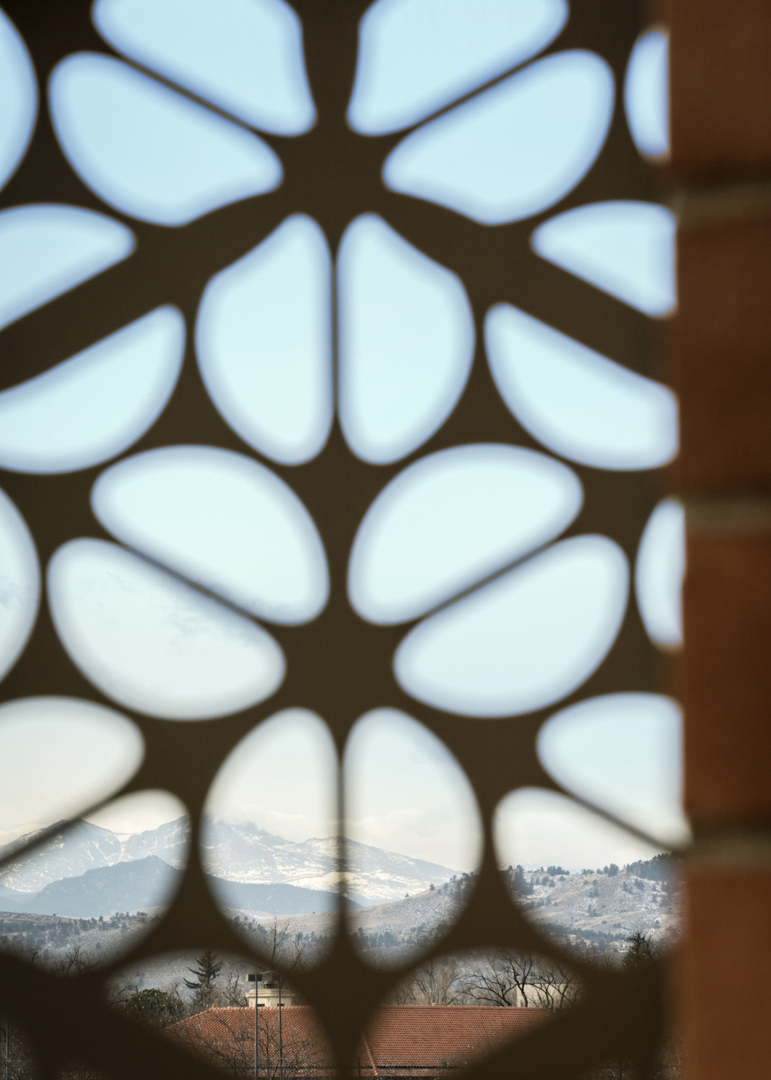 View through metal used in door frame, looking out into the mountains