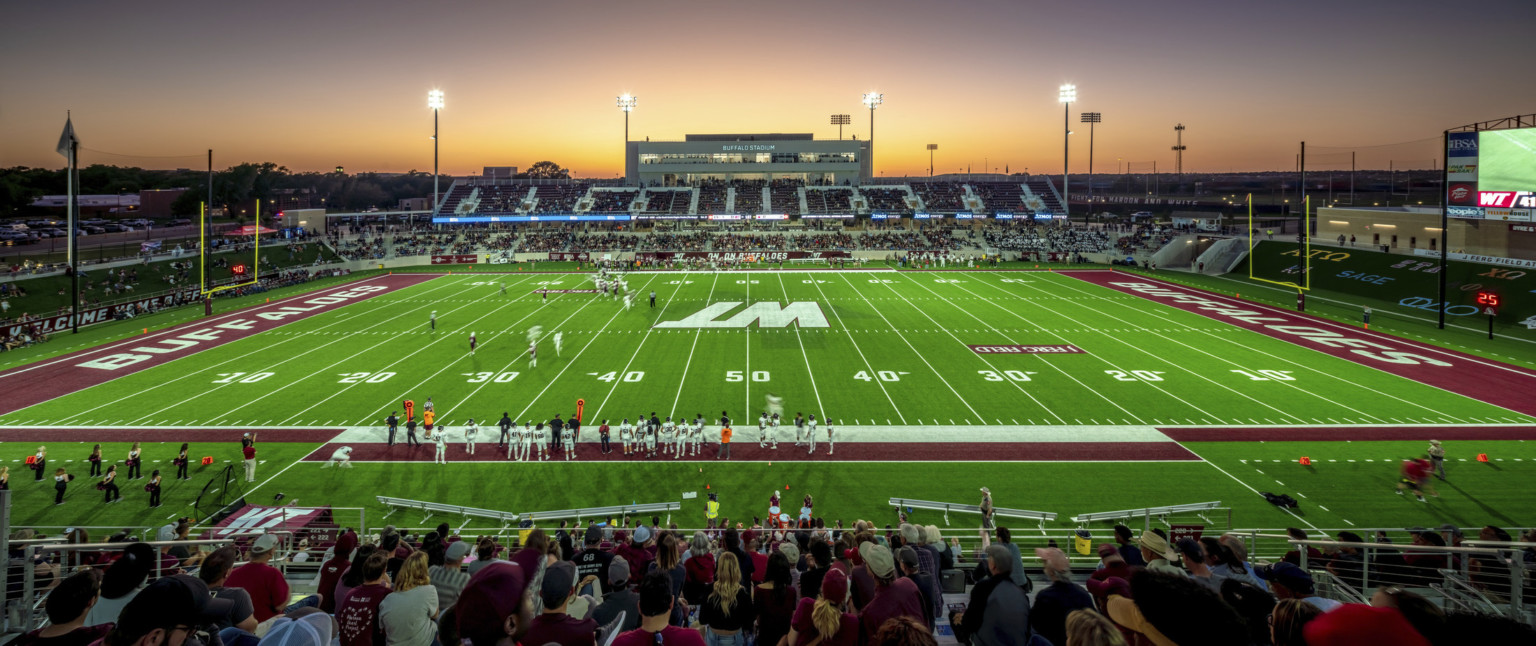 Rendering of football field seen from upper deck seating at 50 yard line. Dark red end zones with Buffaloes written on each