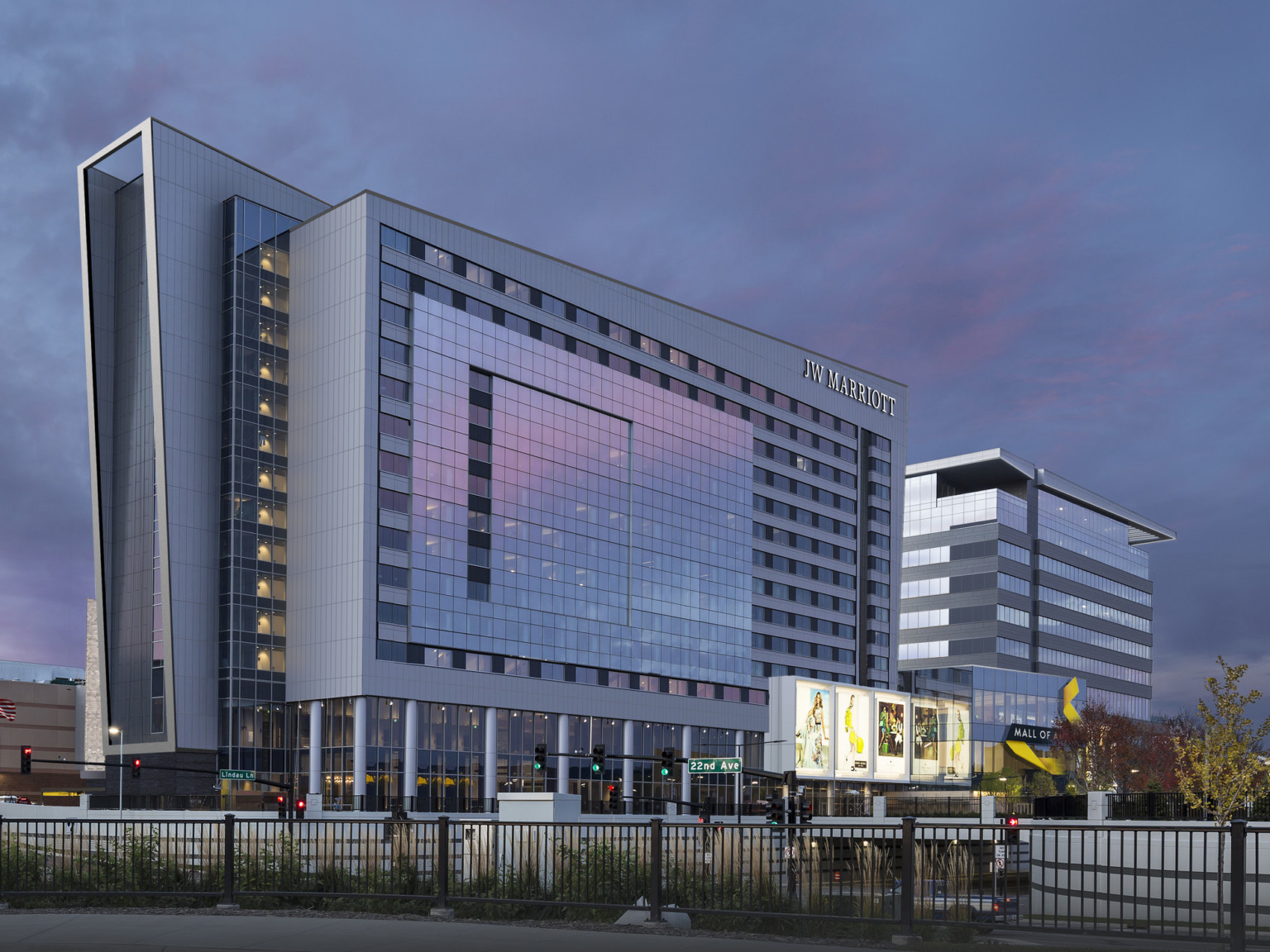 Hotel seen from side from across the street. Elevated outcropped section, while recessed section extends left at angle