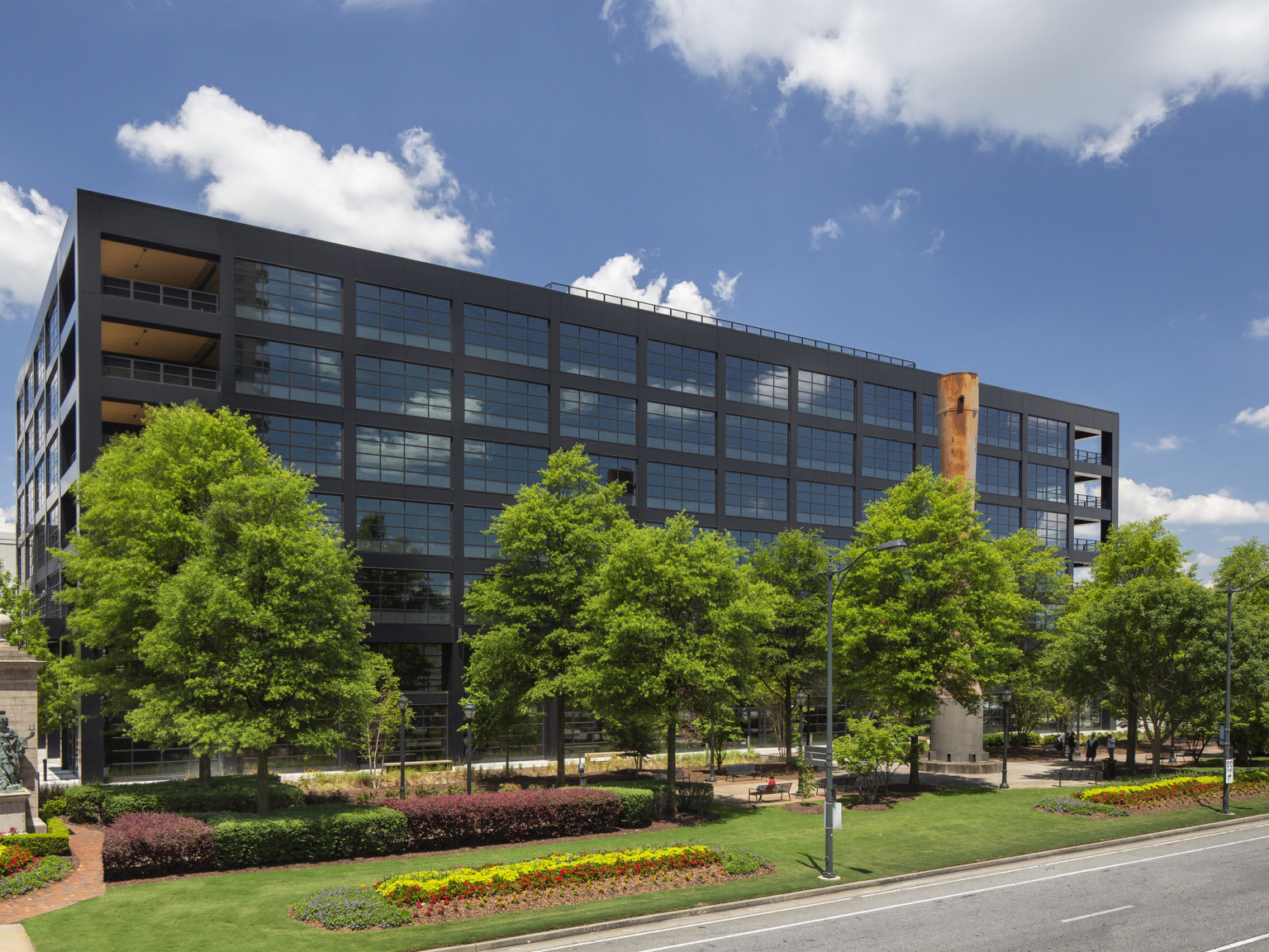 Hines T3 location in West Midtown Atlanta tree lined glass and exposed steel facade midrise building