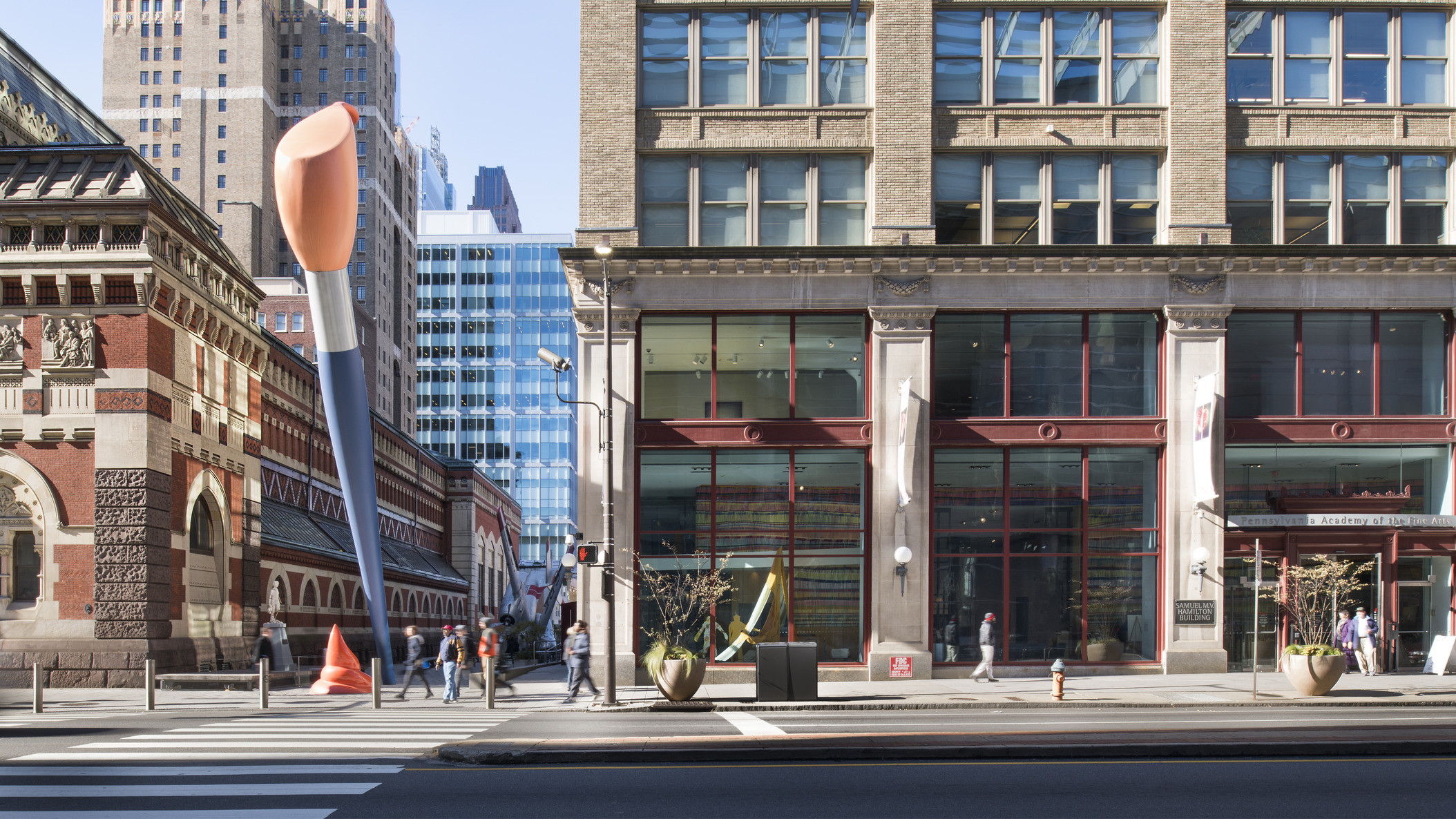 street view of Pennsylvania Academy of the Fine Arts building with two story blue and orange paint brush sculpture outside